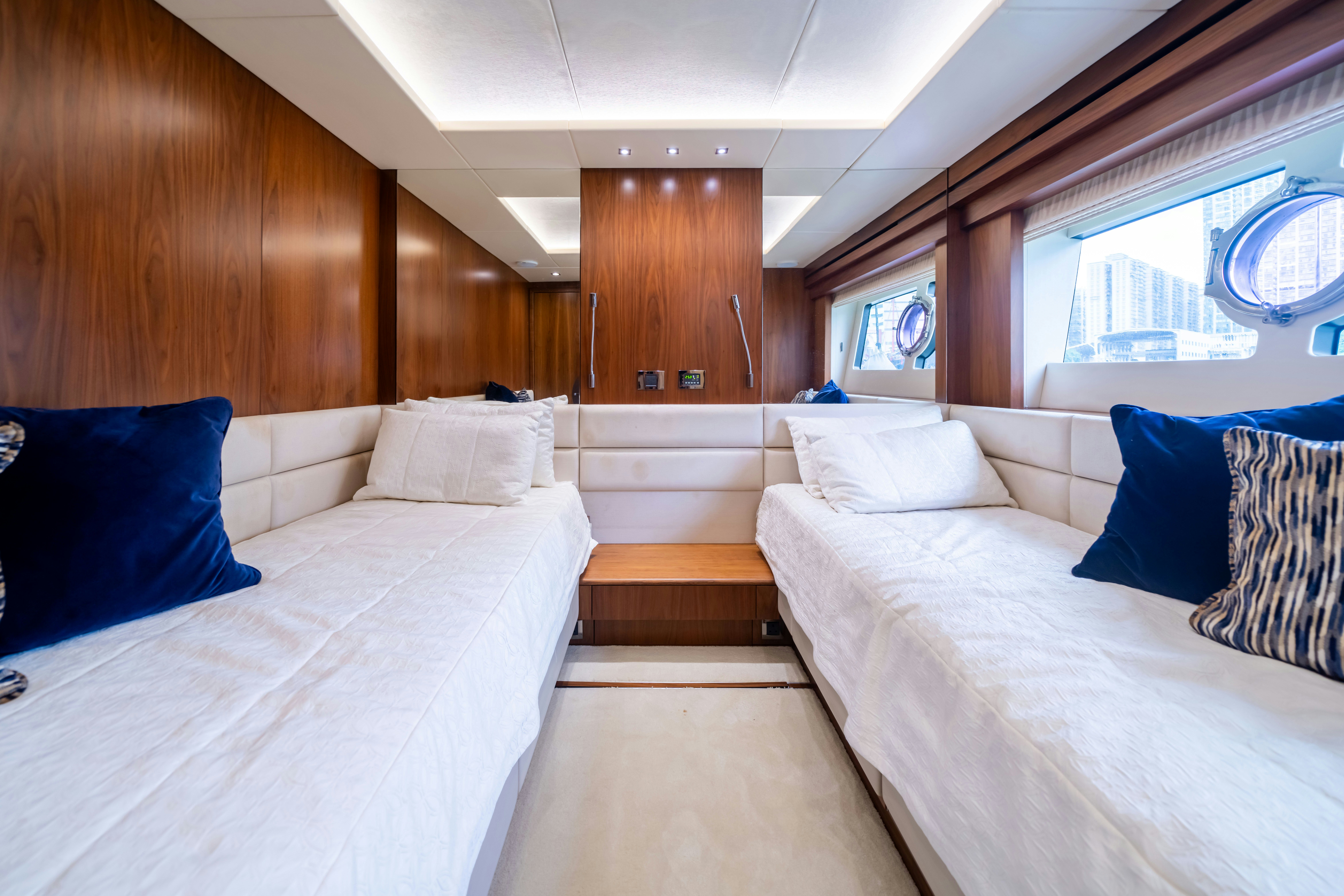 a room with two beds aboard DRAGON Yacht for Sale