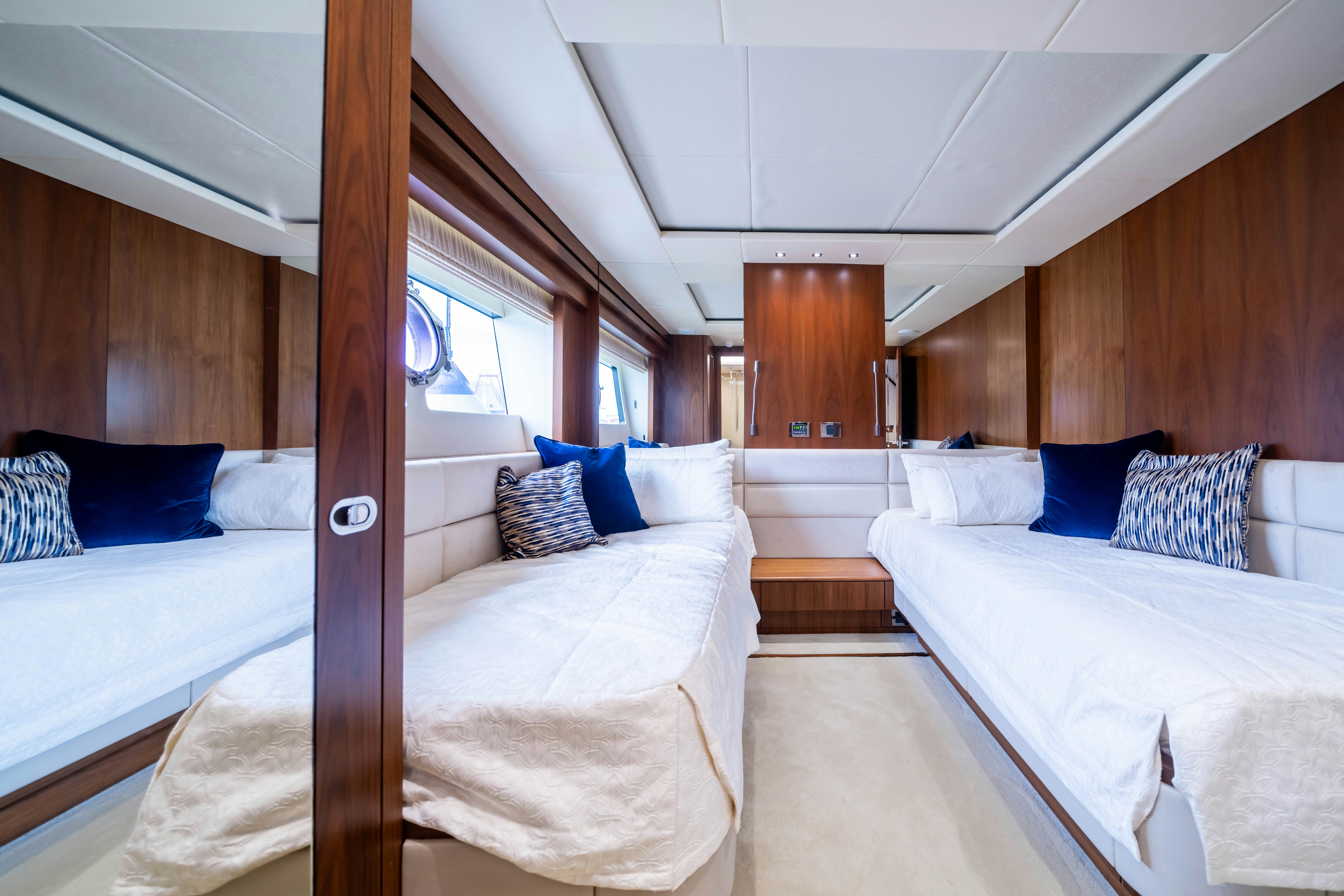 a room with two beds aboard DRAGON Yacht for Sale