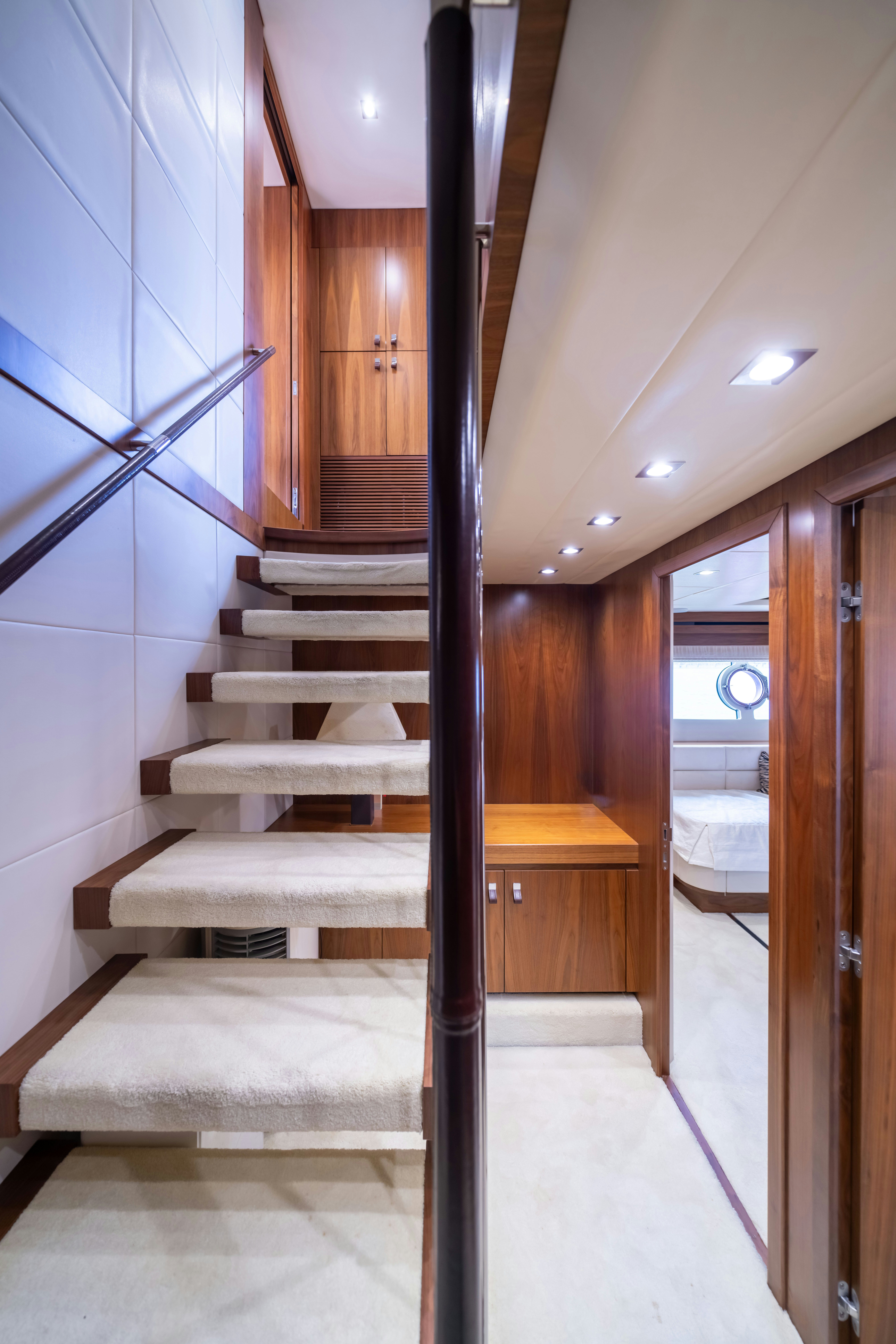 a staircase with a glass door aboard DRAGON Yacht for Sale
