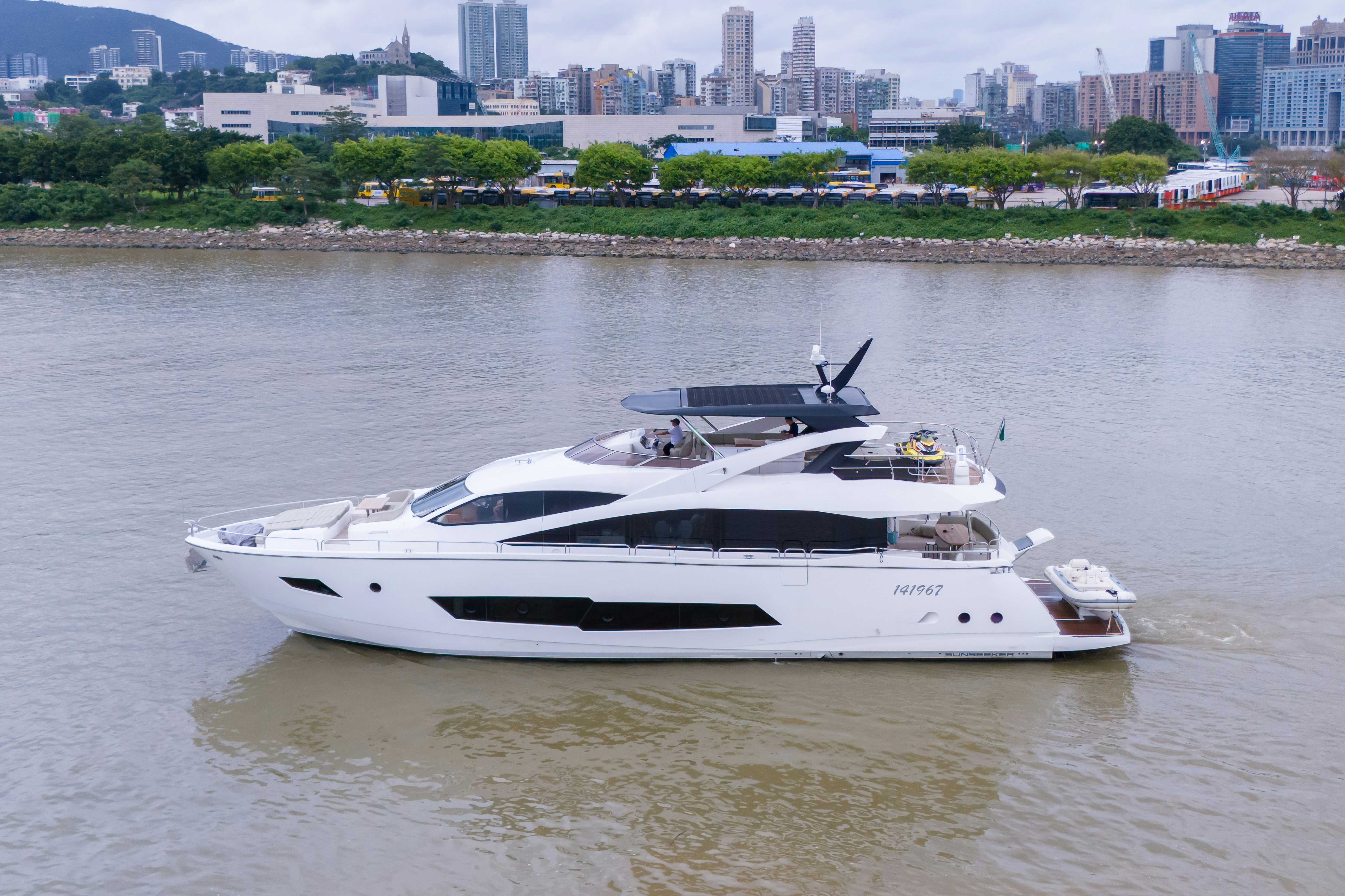 a white boat in a river aboard DRAGON Yacht for Sale