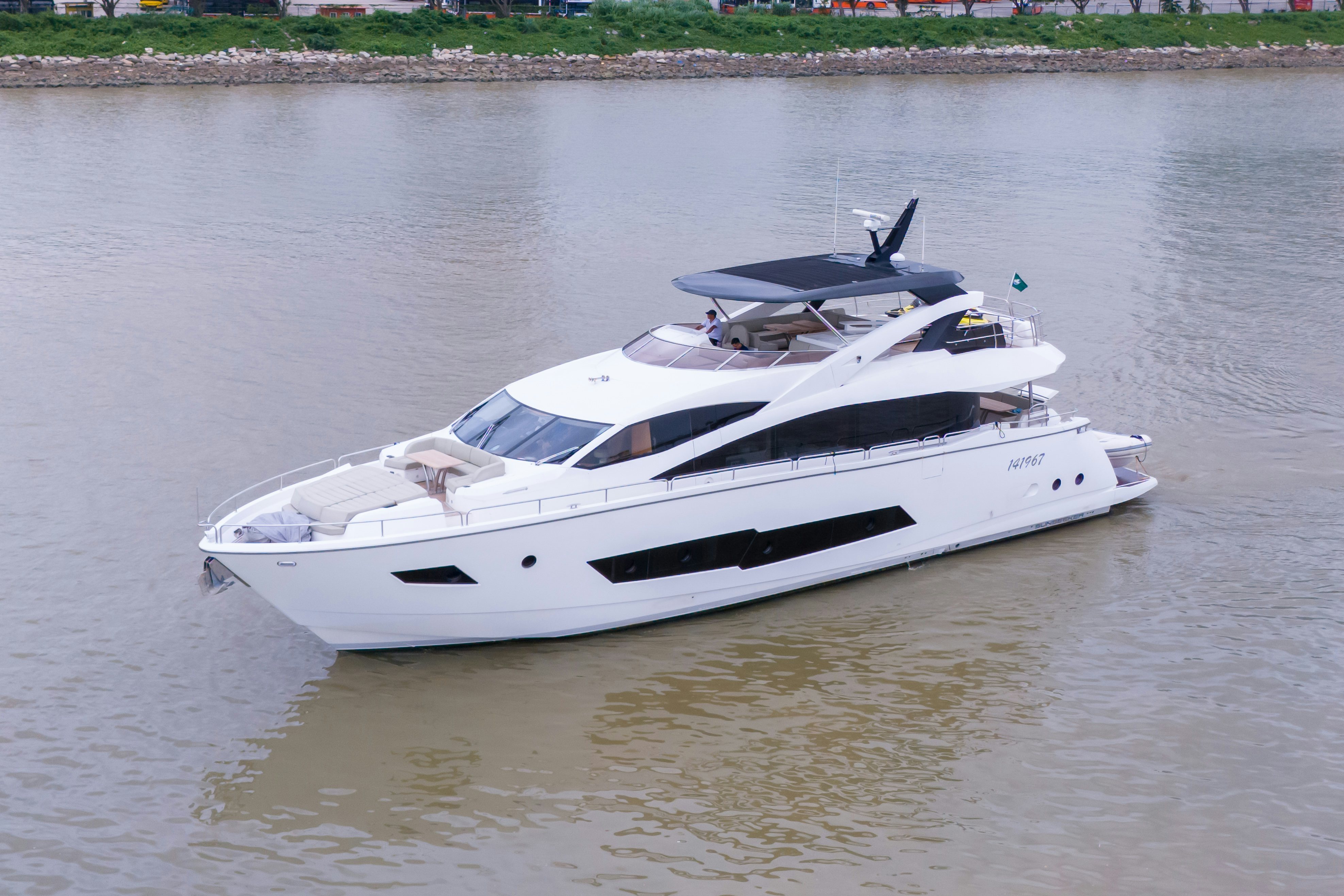 a white boat on the water aboard DRAGON Yacht for Sale