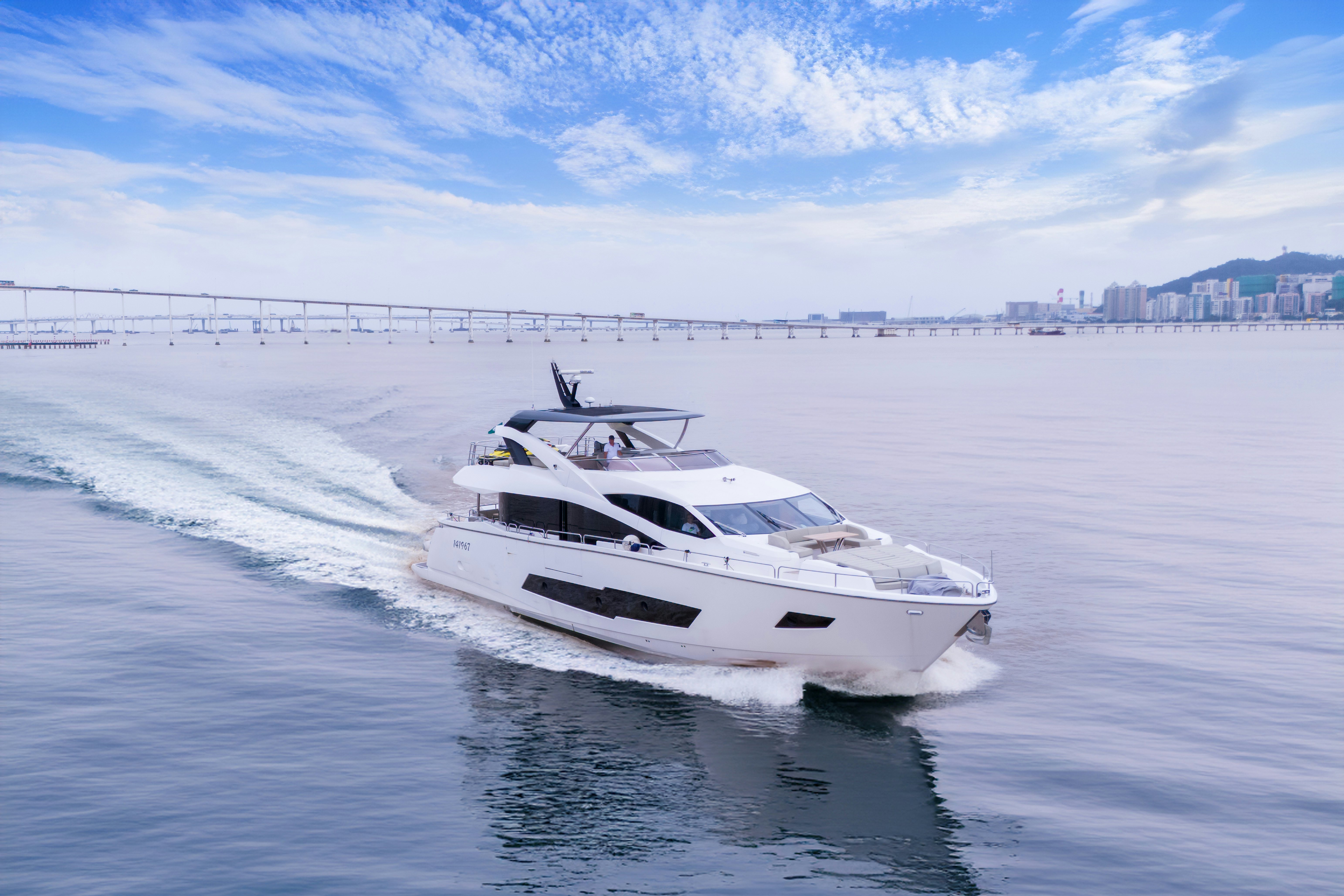 a white boat on the water aboard DRAGON Yacht for Sale
