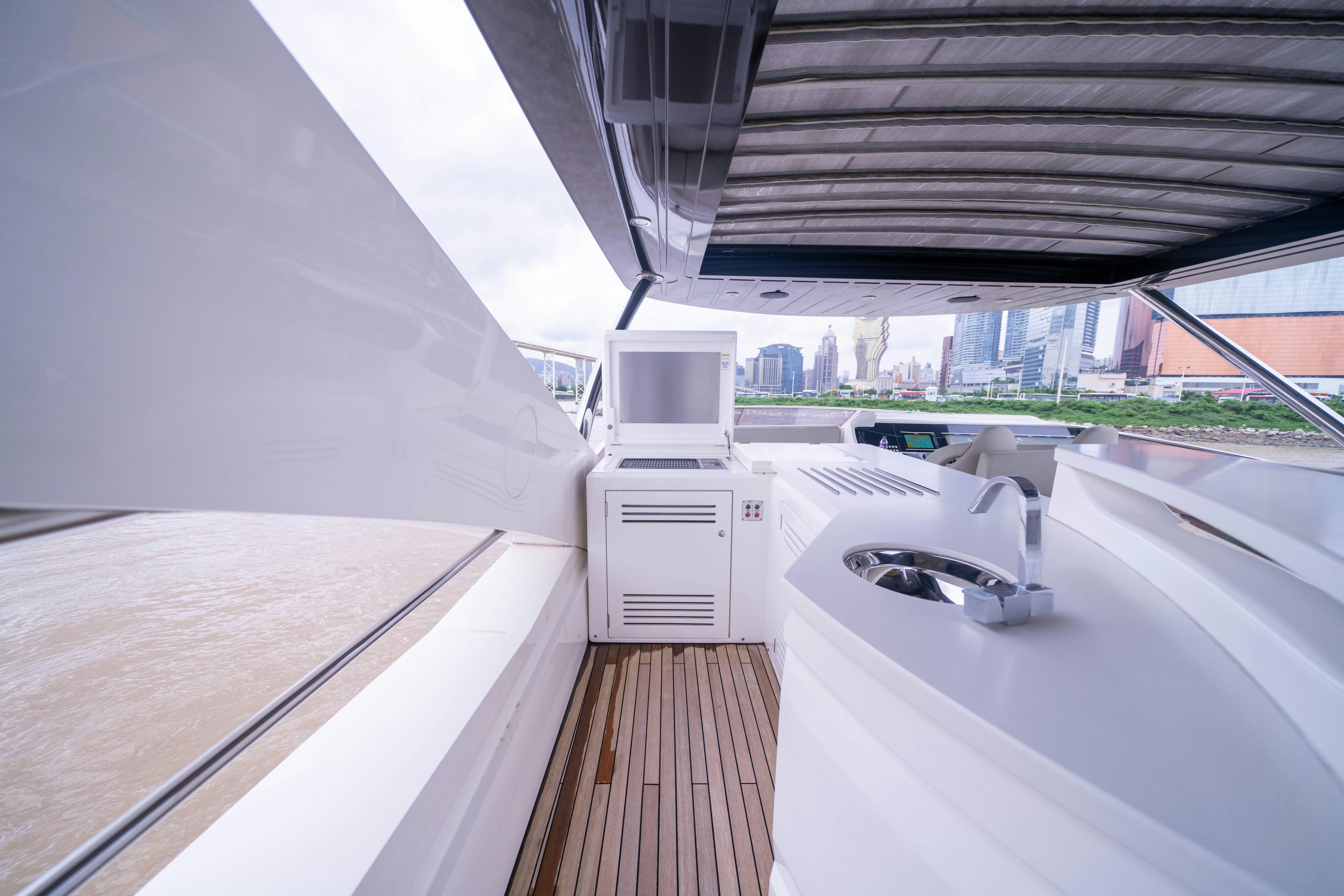 a deck with a view of a city aboard DRAGON Yacht for Sale