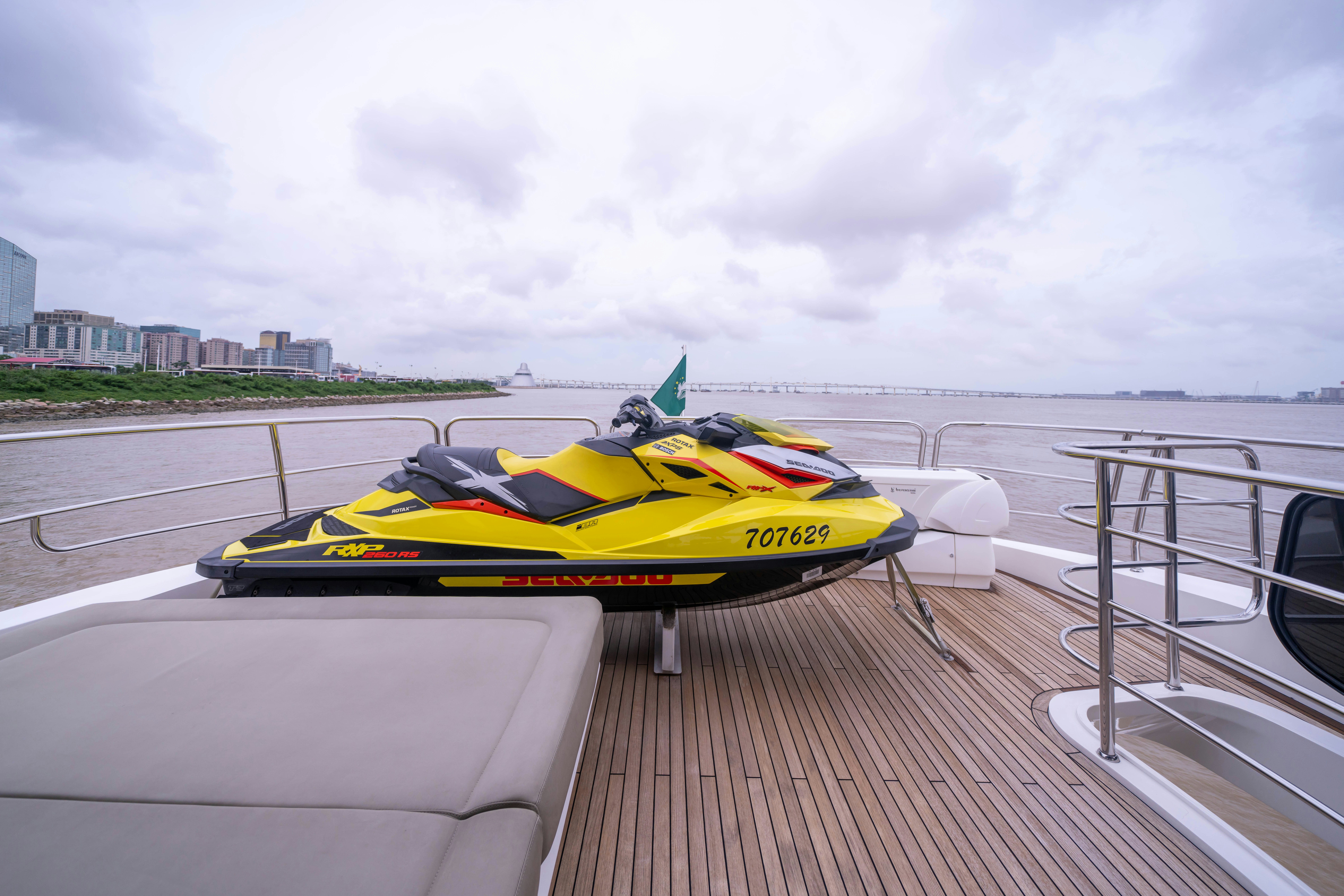 a speed boat on a deck aboard DRAGON Yacht for Sale