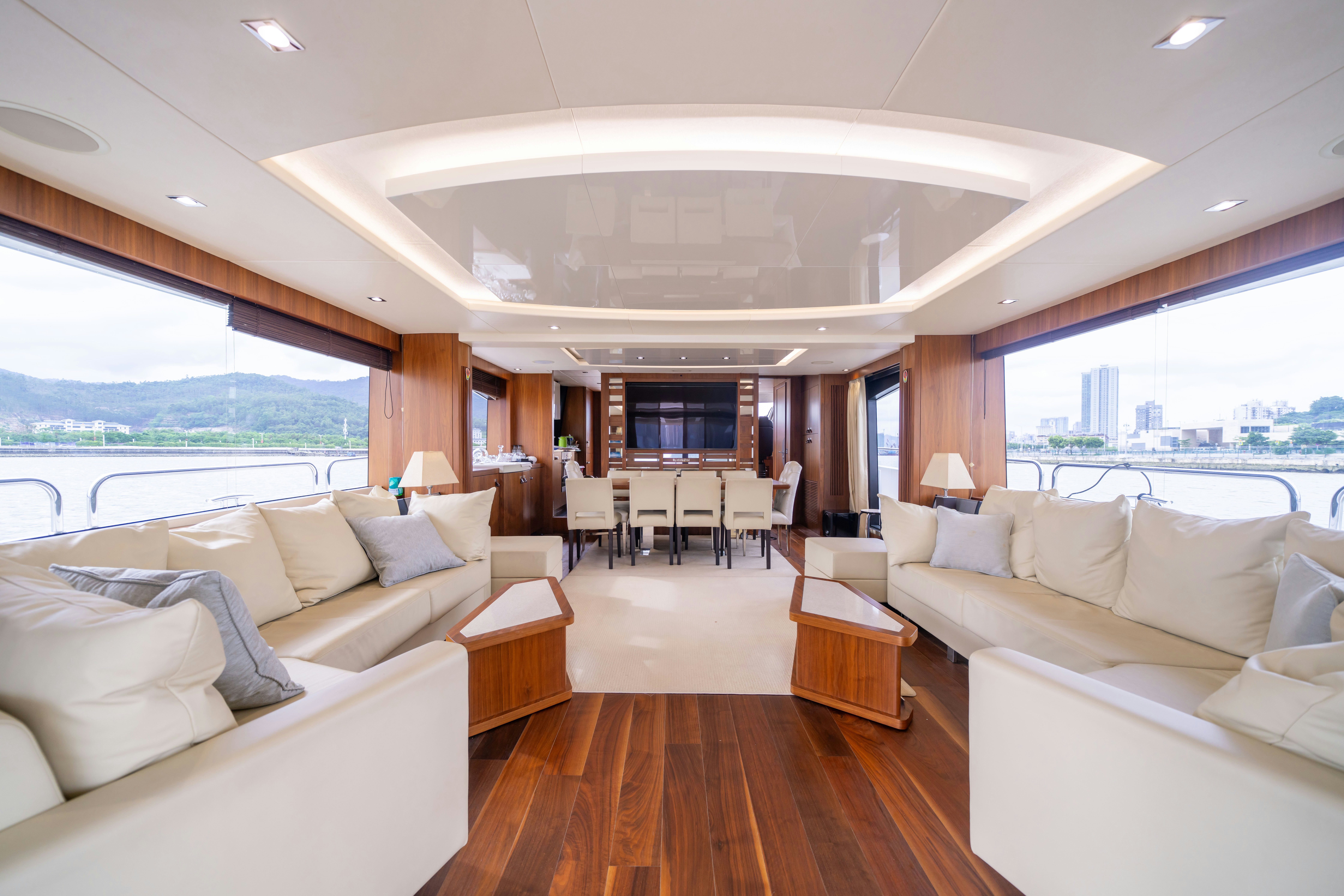 a living room with a large window aboard DRAGON Yacht for Sale