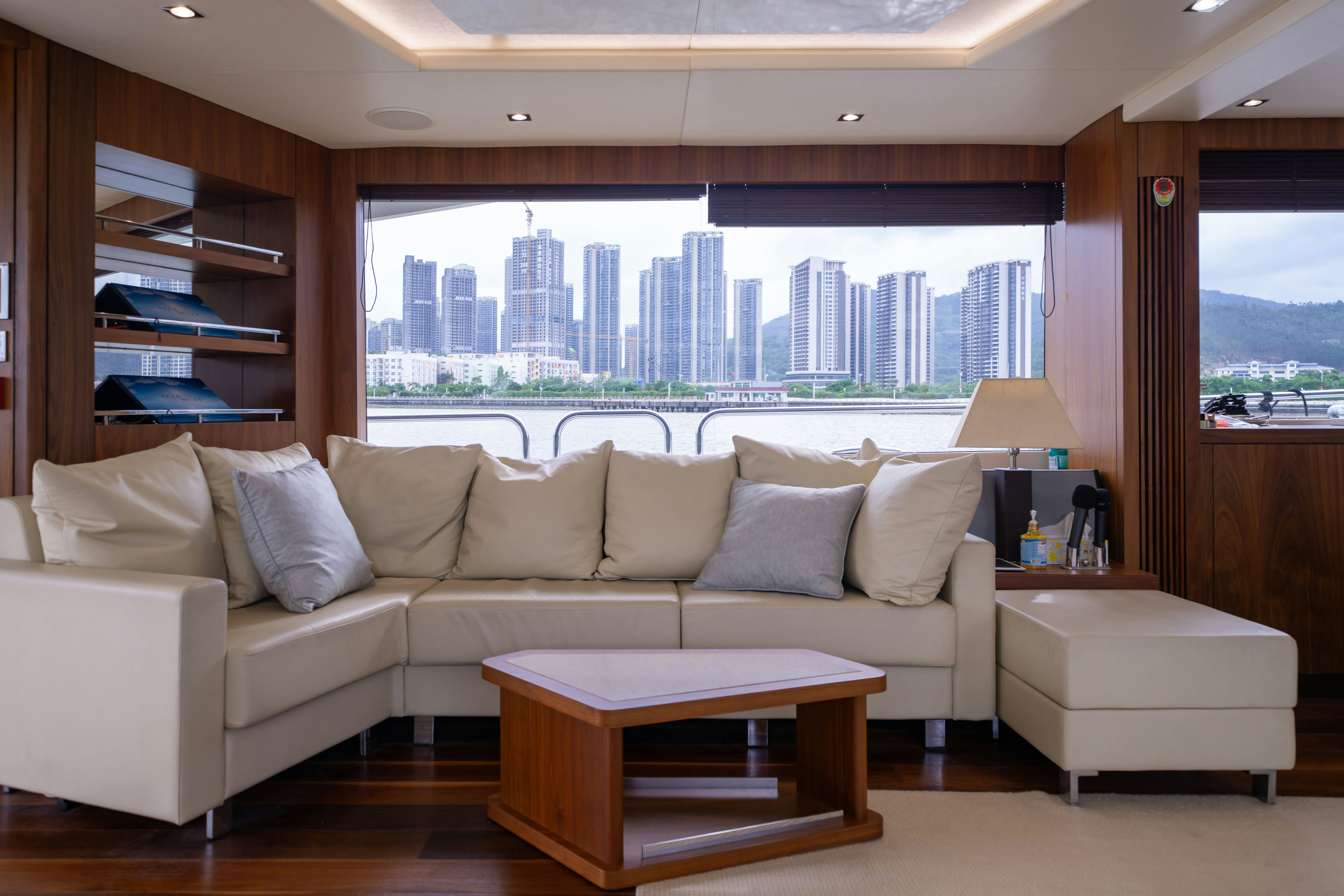 a living room with a large window aboard DRAGON Yacht for Sale