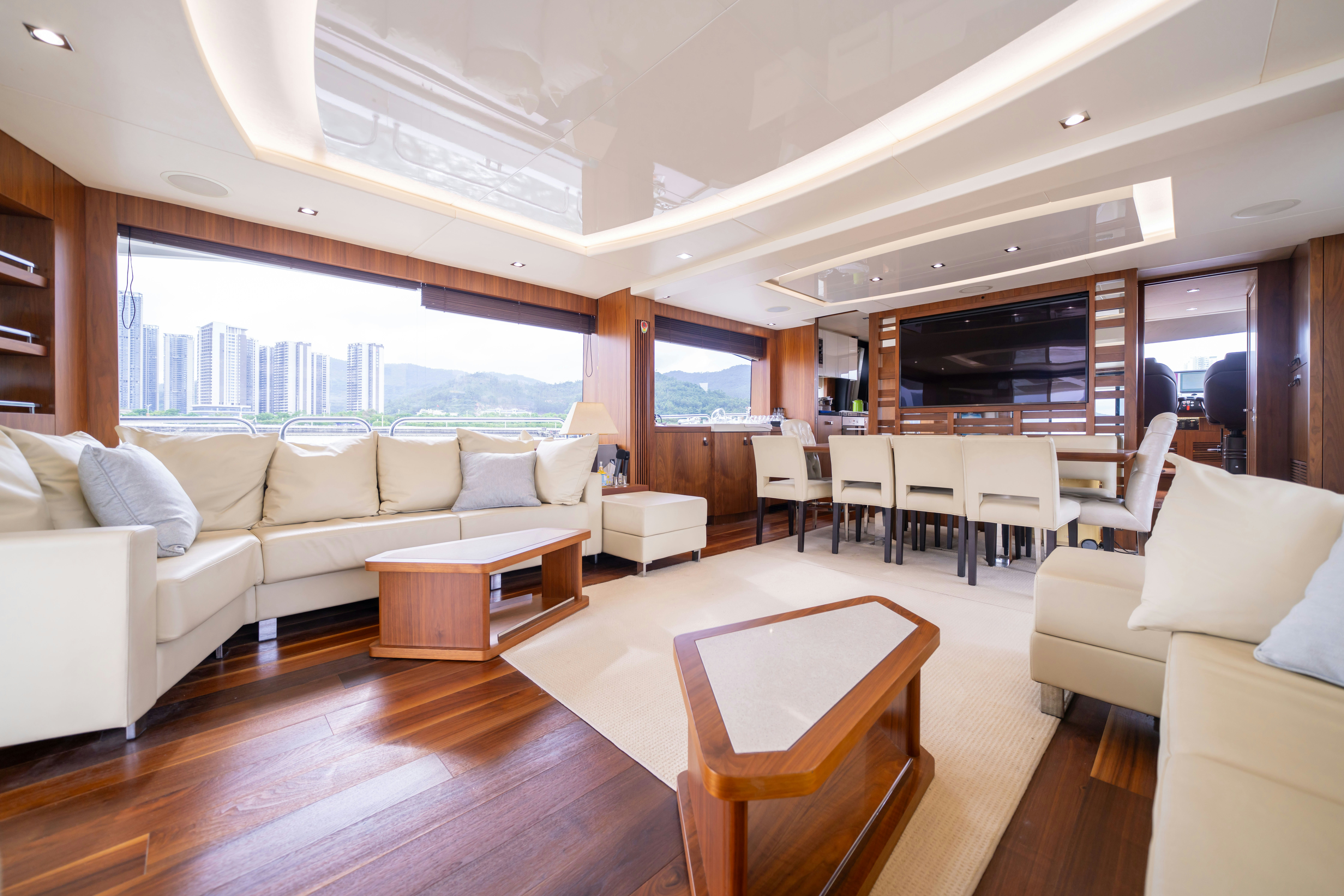a living room with a couch and a table aboard DRAGON Yacht for Sale