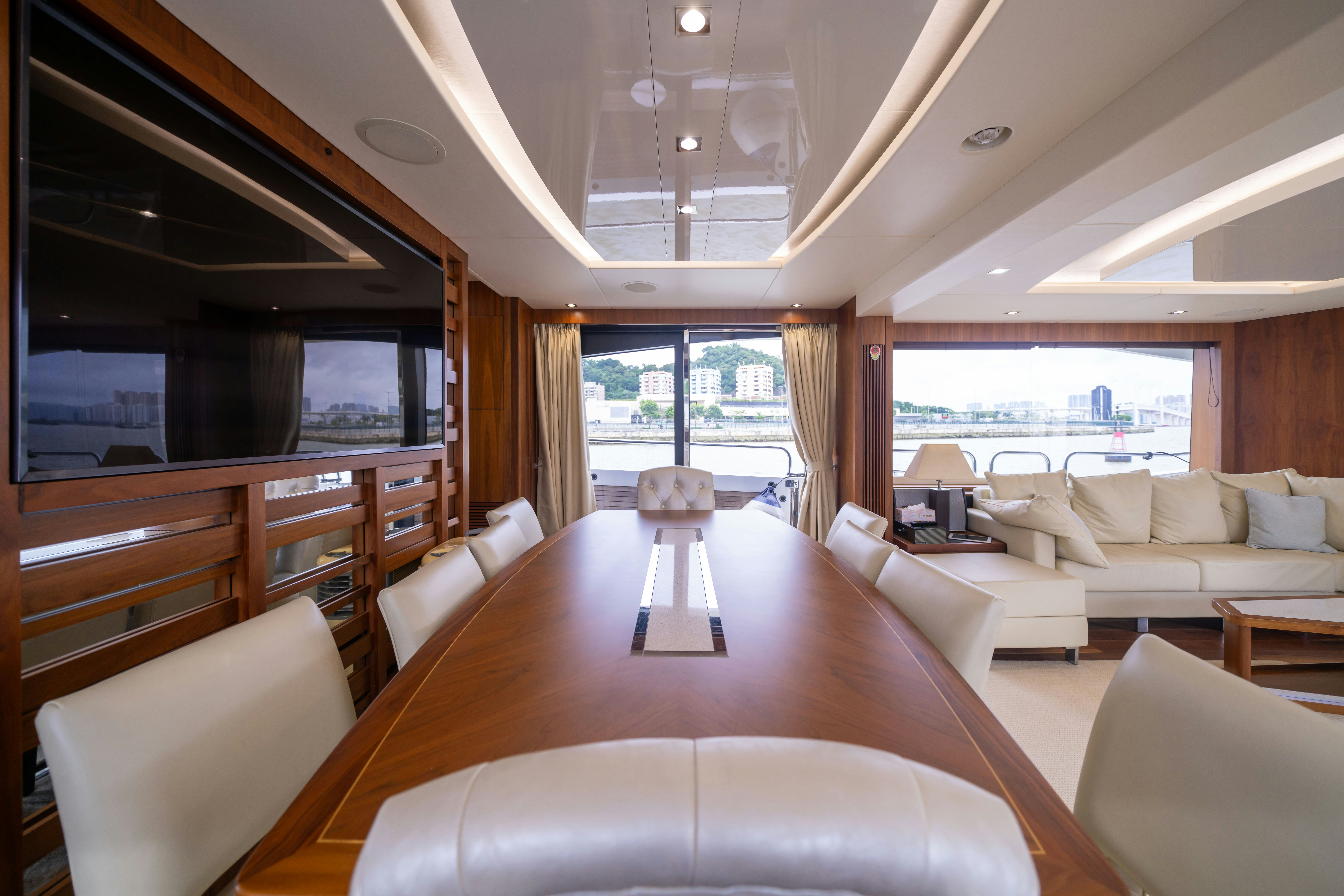 a living room with a large window aboard DRAGON Yacht for Sale