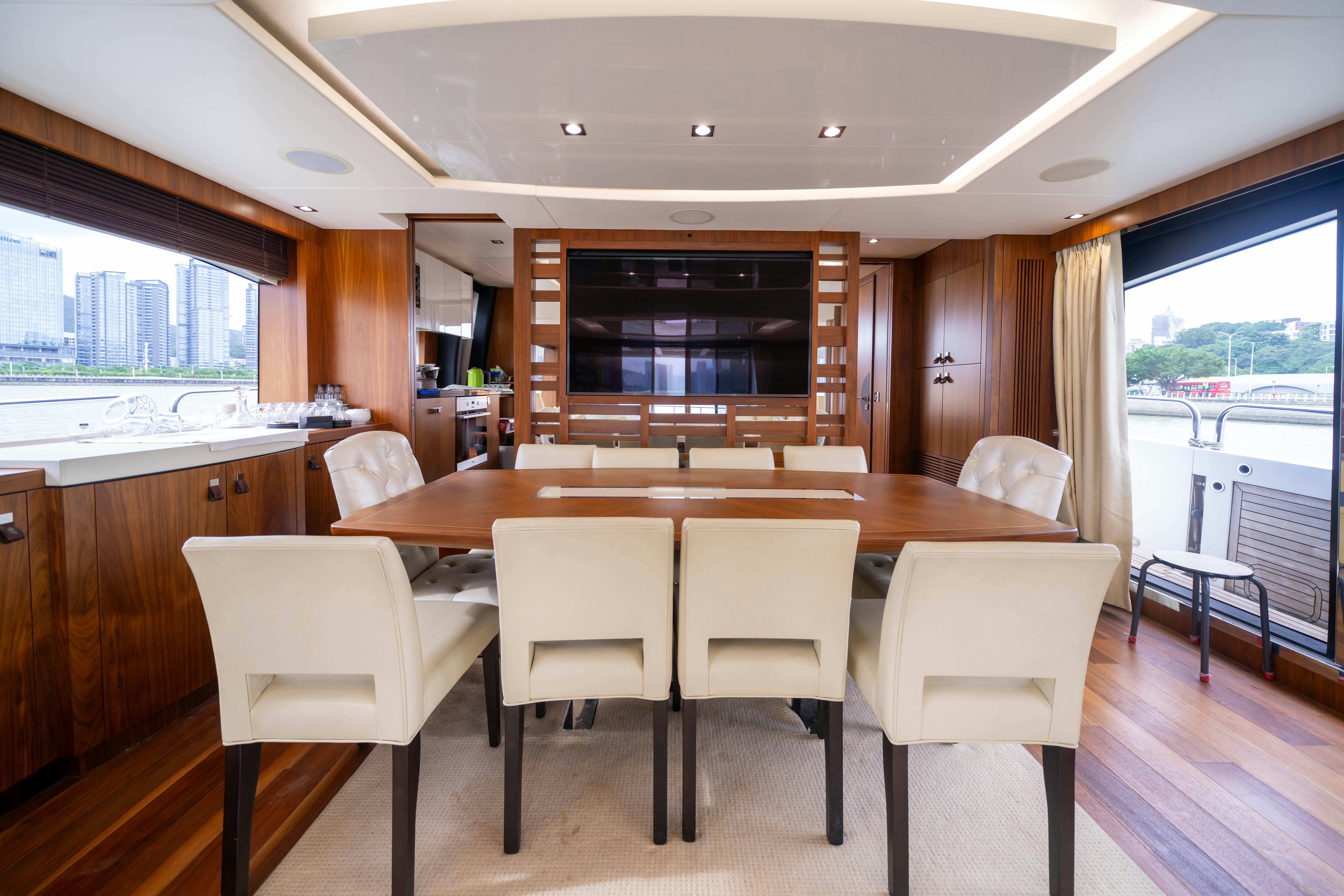 a large kitchen with a table and chairs aboard DRAGON Yacht for Sale