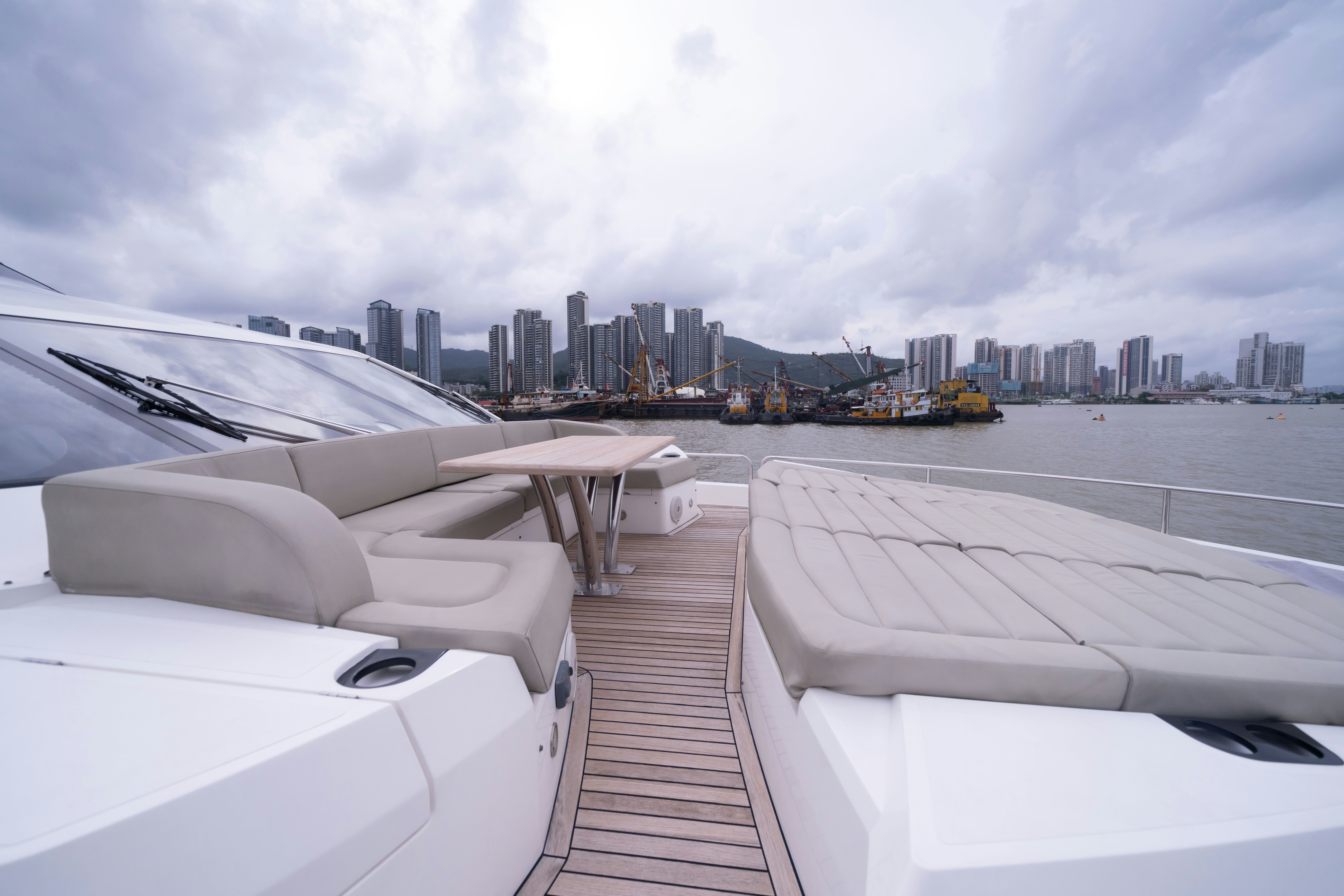 a deck with a view of a city and a body of water aboard DRAGON Yacht for Sale
