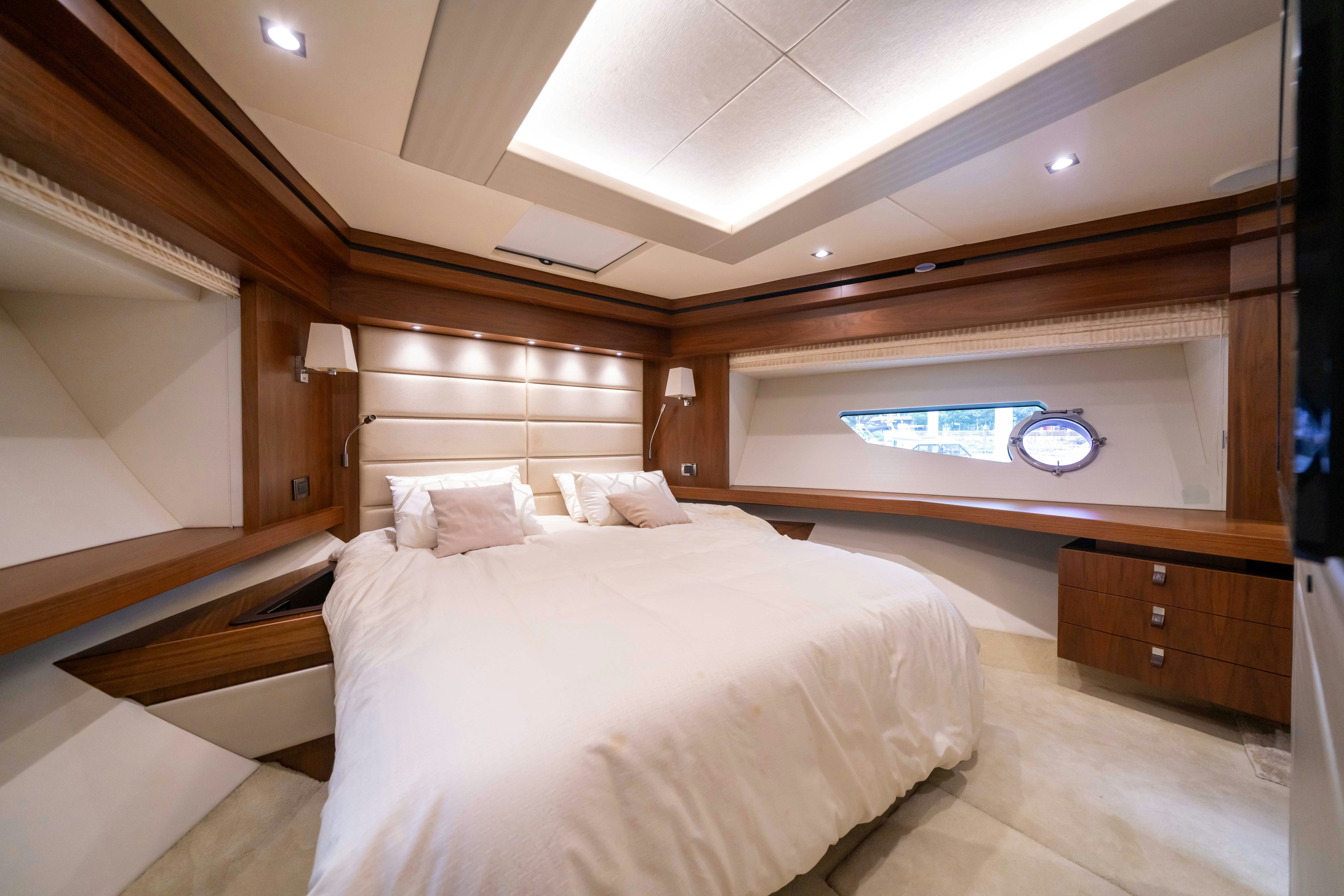 a room with a bed and a desk aboard DRAGON Yacht for Sale