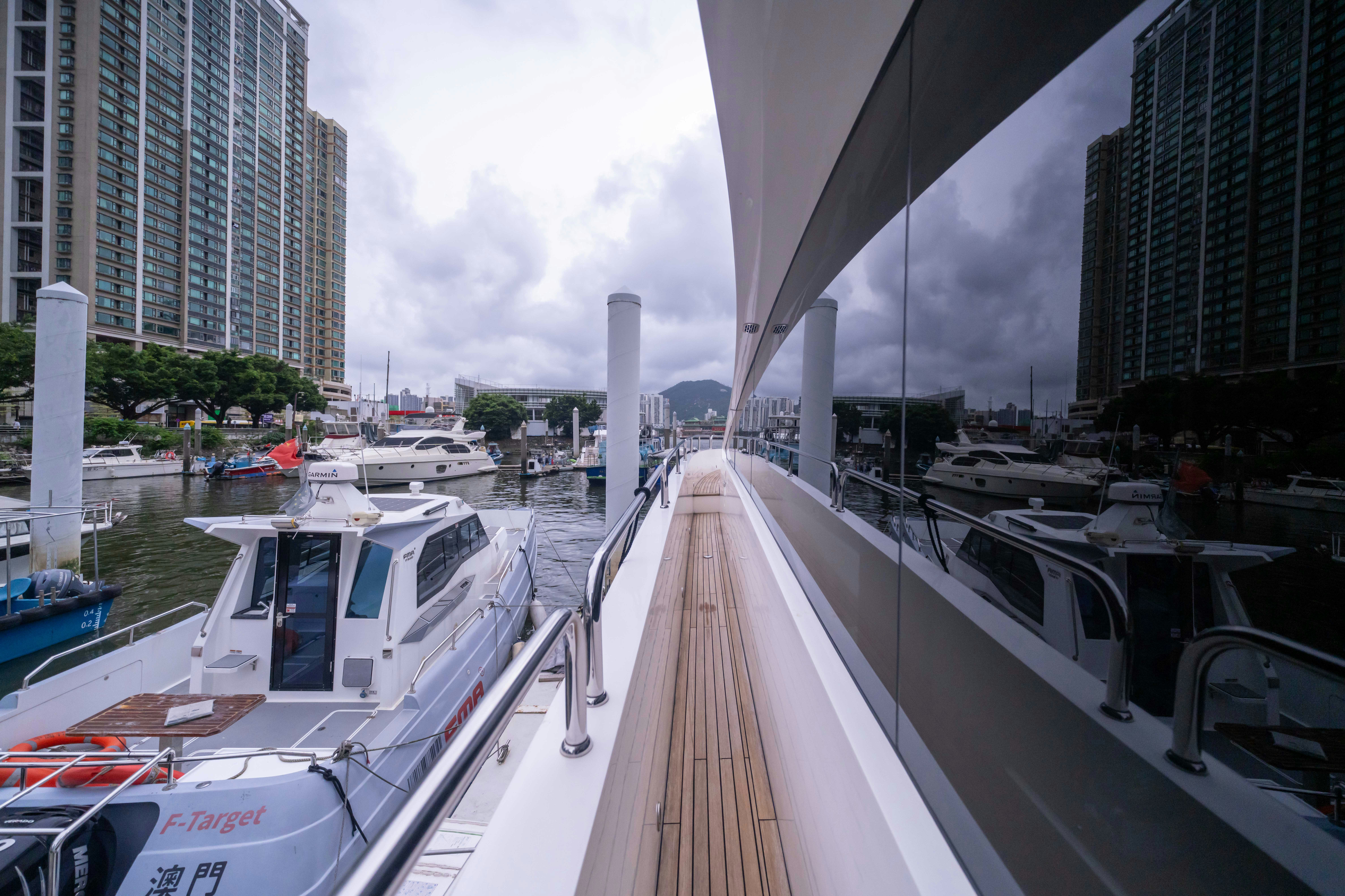 a long dock with boats aboard DRAGON Yacht for Sale