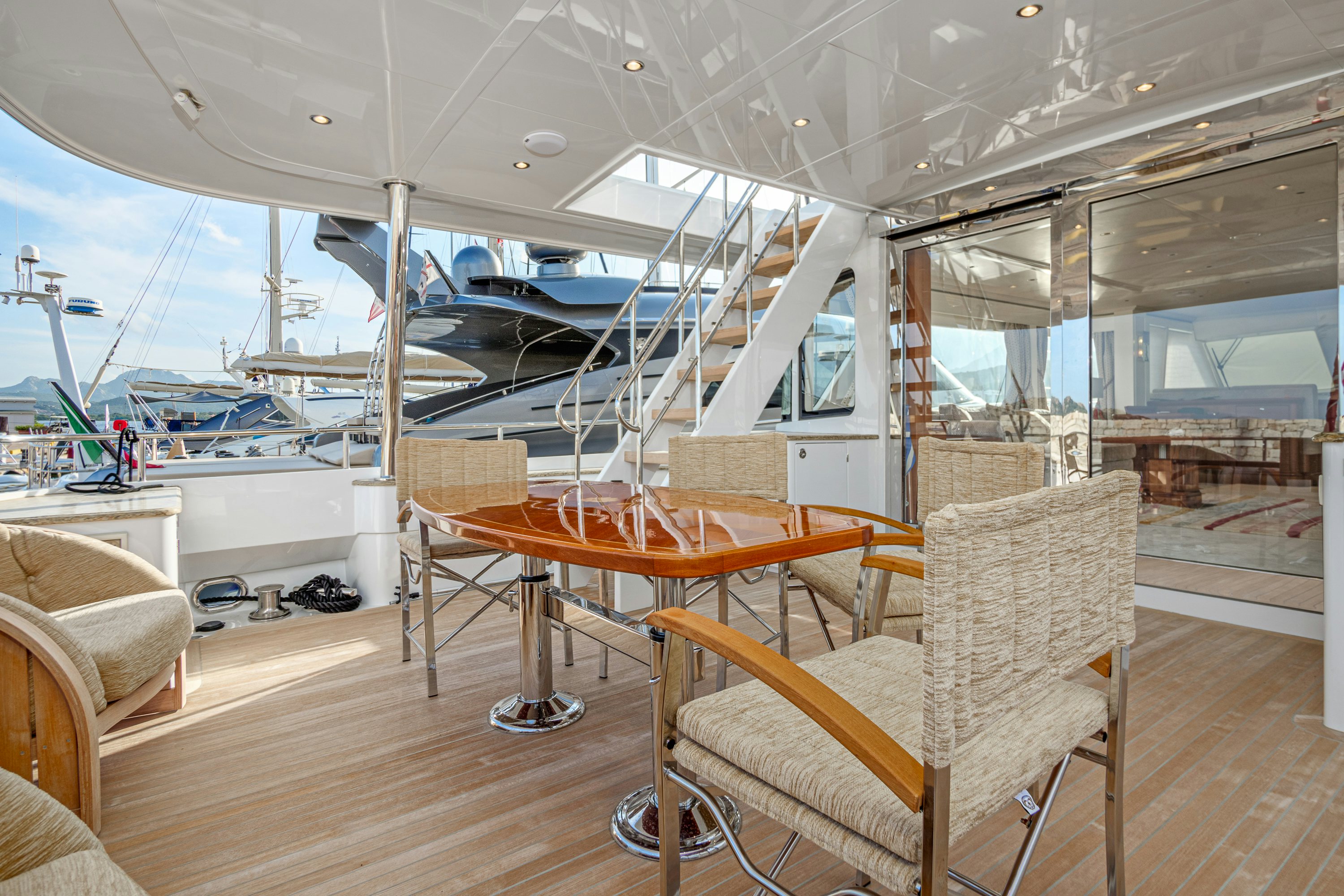 a room with a table and chairs aboard FRIVOLOUS Yacht for Sale