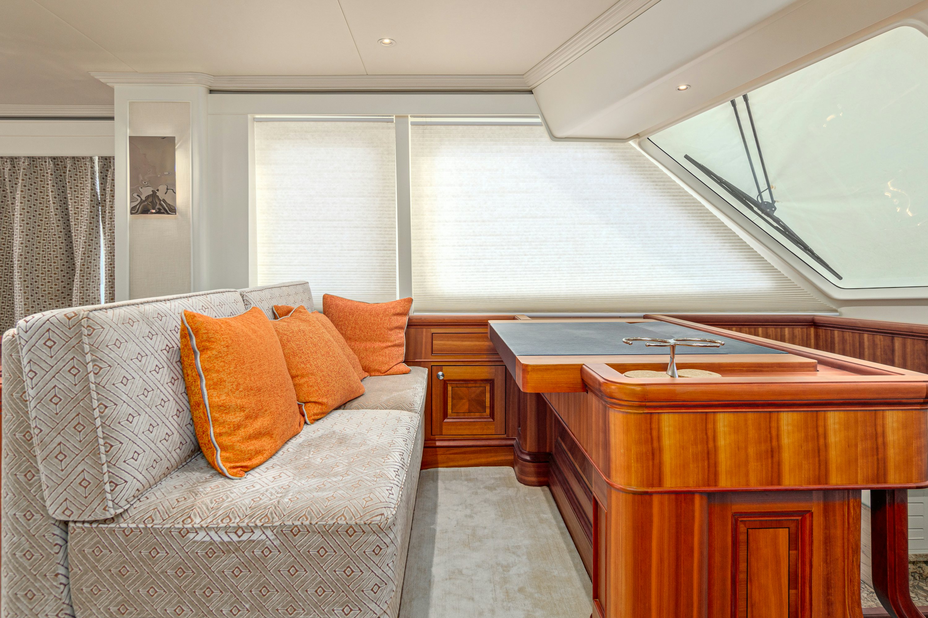 a room with a couch and a desk aboard FRIVOLOUS Yacht for Sale