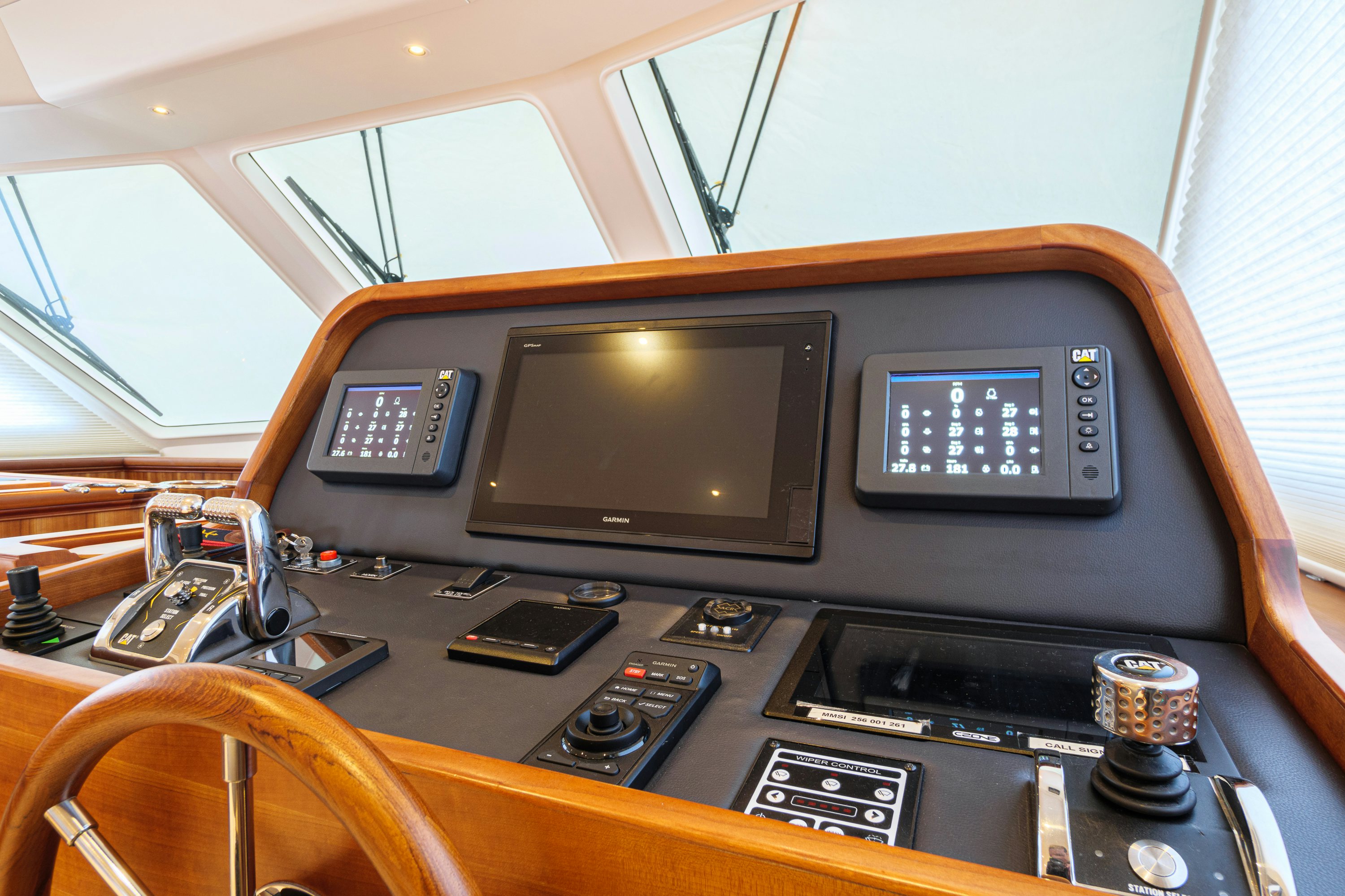 a radio and other electronics on a table aboard FRIVOLOUS Yacht for Sale