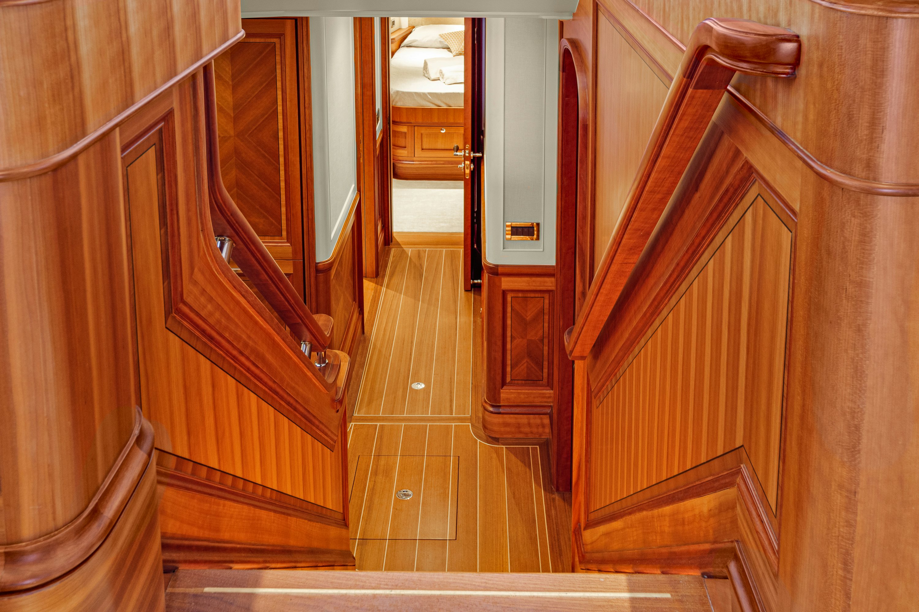 a hallway with wooden doors aboard FRIVOLOUS Yacht for Sale