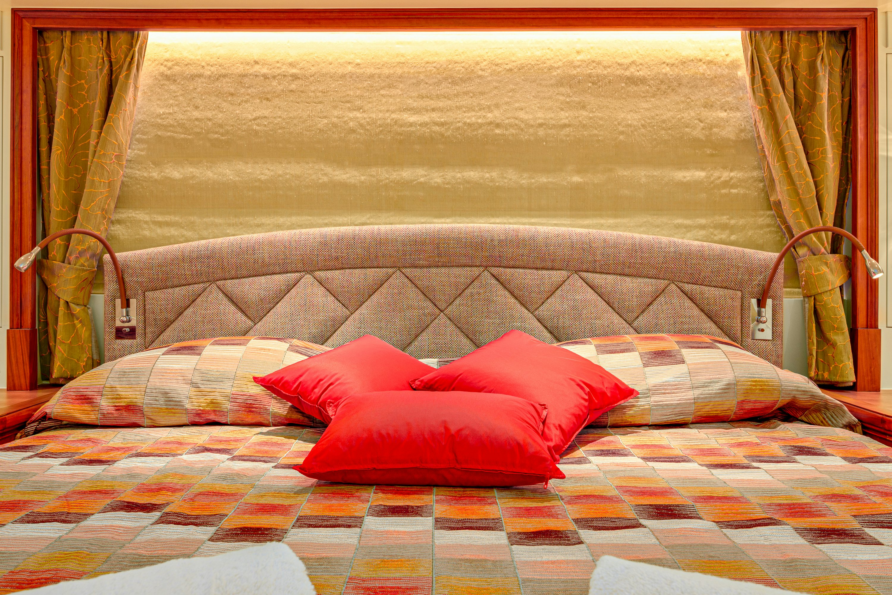 a bed with pillows aboard FRIVOLOUS Yacht for Sale