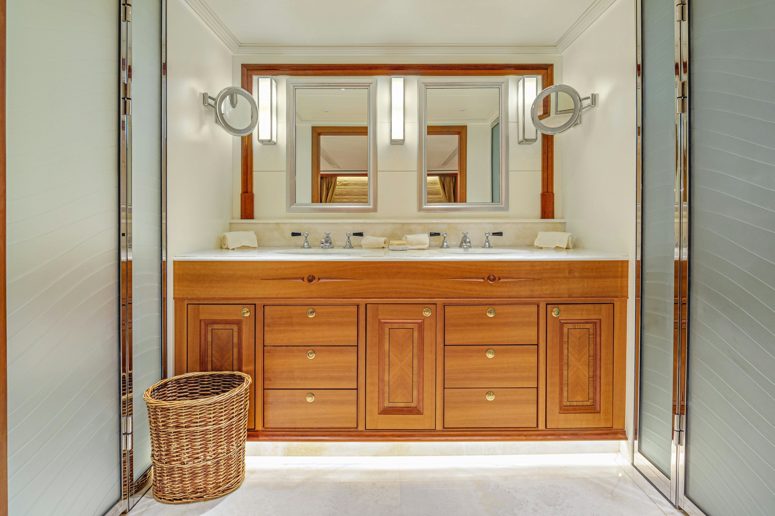 a bathroom with a sink and cabinets aboard FRIVOLOUS Yacht for Sale