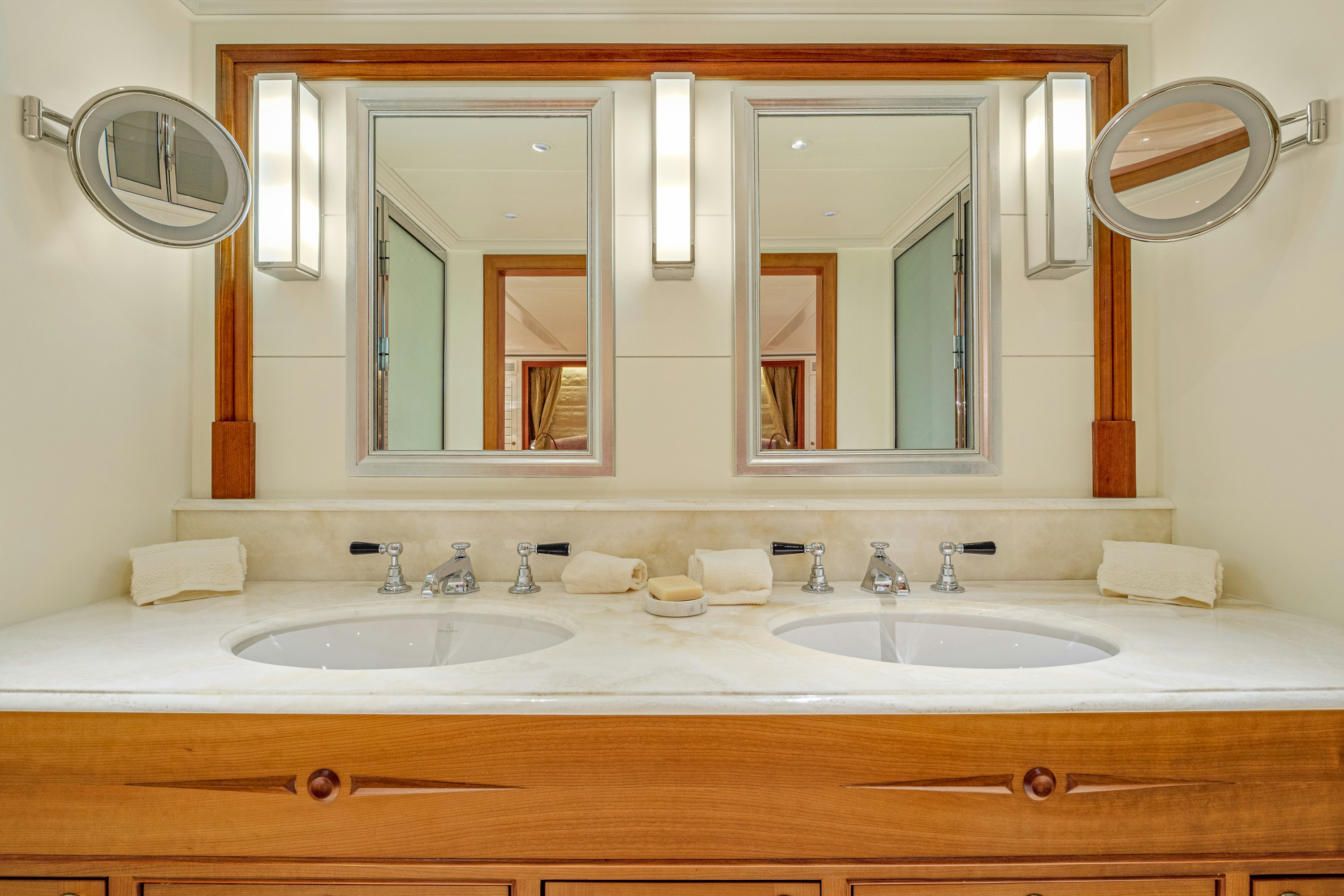 a bathroom with two sinks aboard FRIVOLOUS Yacht for Sale