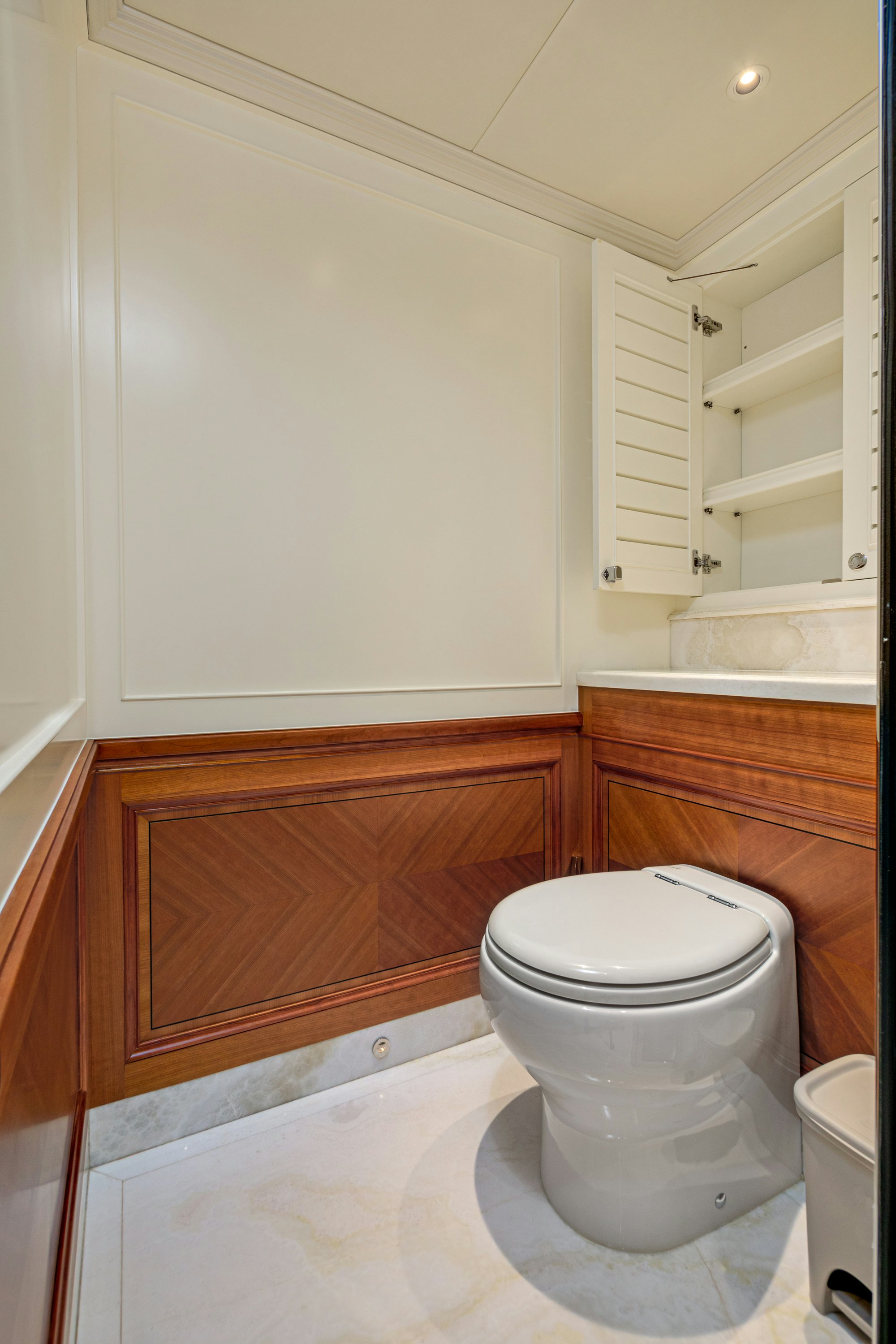 a toilet in a bathroom aboard FRIVOLOUS Yacht for Sale