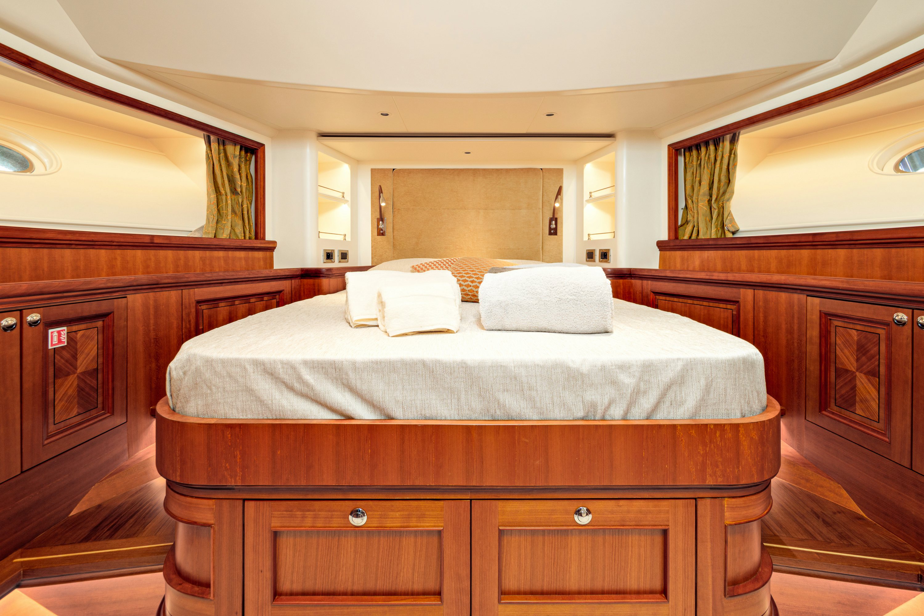 a bed with white sheets aboard FRIVOLOUS Yacht for Sale