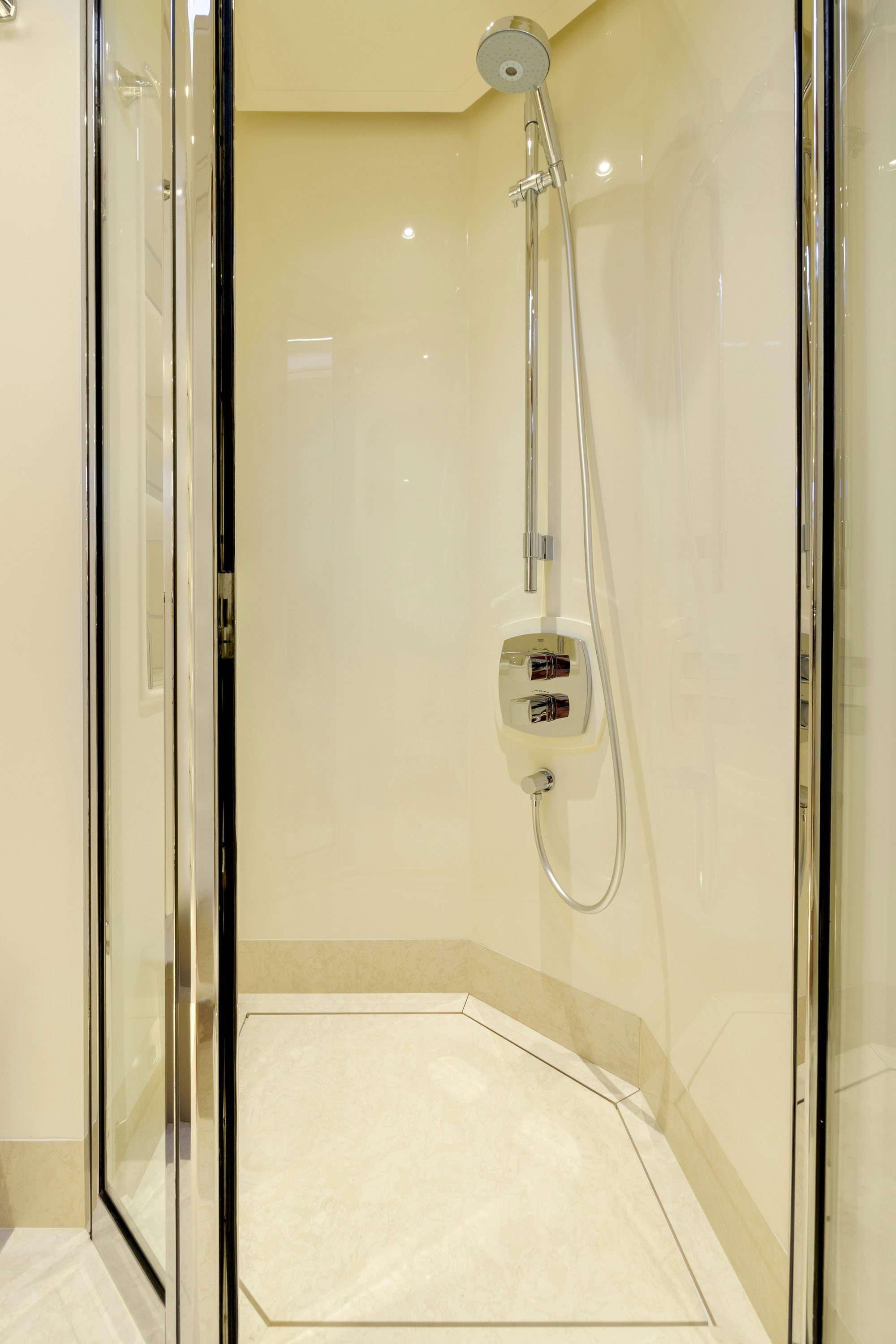 a white urinal with a handle aboard FRIVOLOUS Yacht for Sale