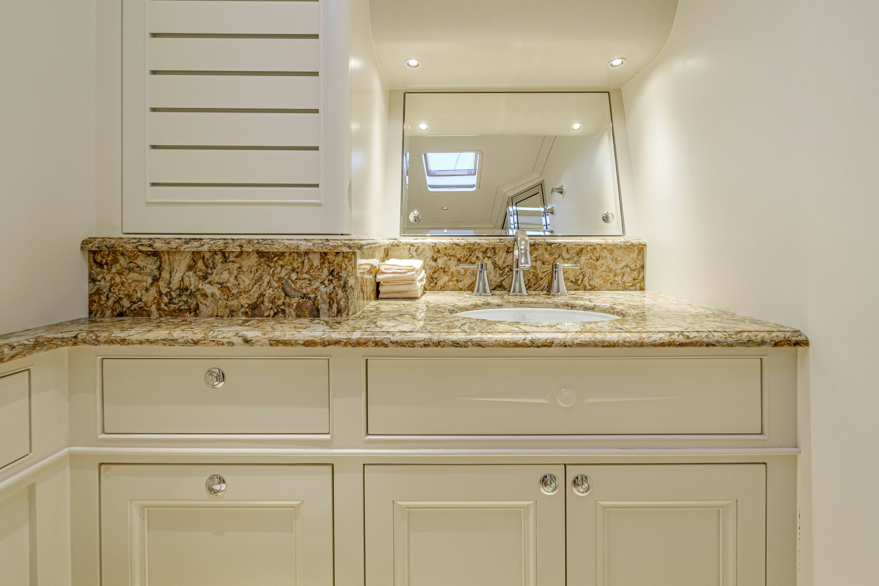 a bathroom with marble counter tops aboard FRIVOLOUS Yacht for Sale