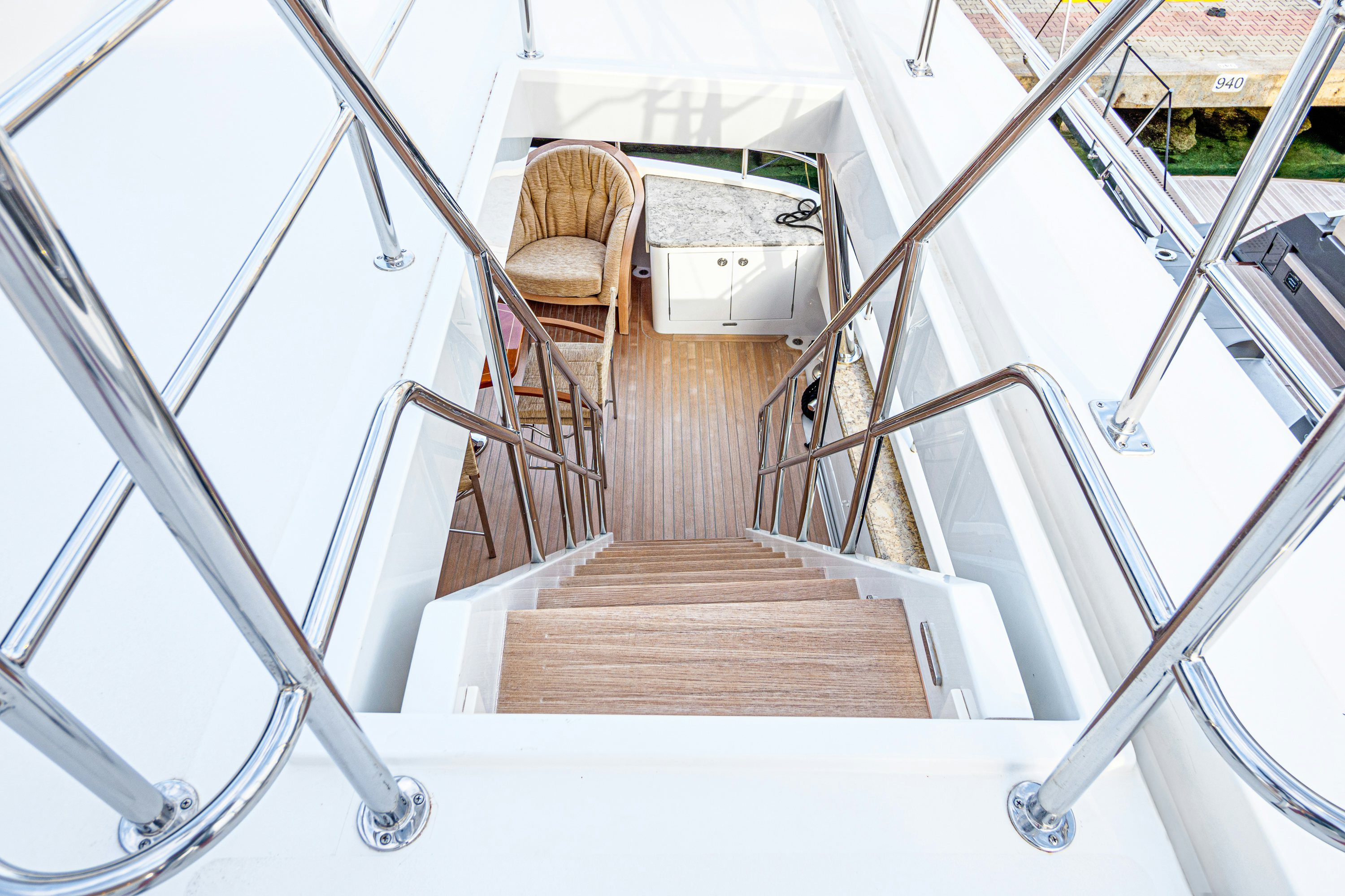 a wooden staircase in a house aboard FRIVOLOUS Yacht for Sale