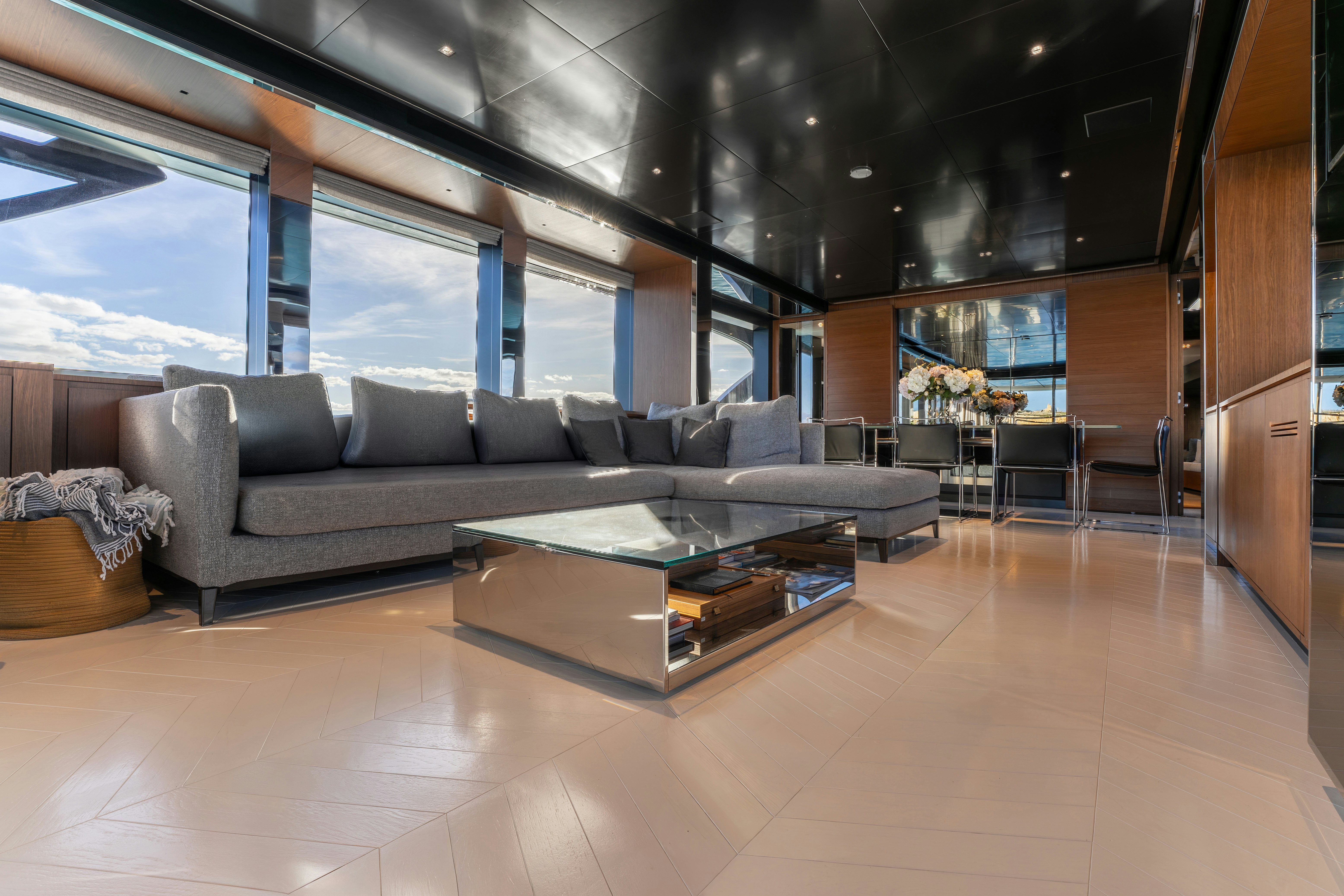 a living room with a couch aboard NOI Yacht for Sale