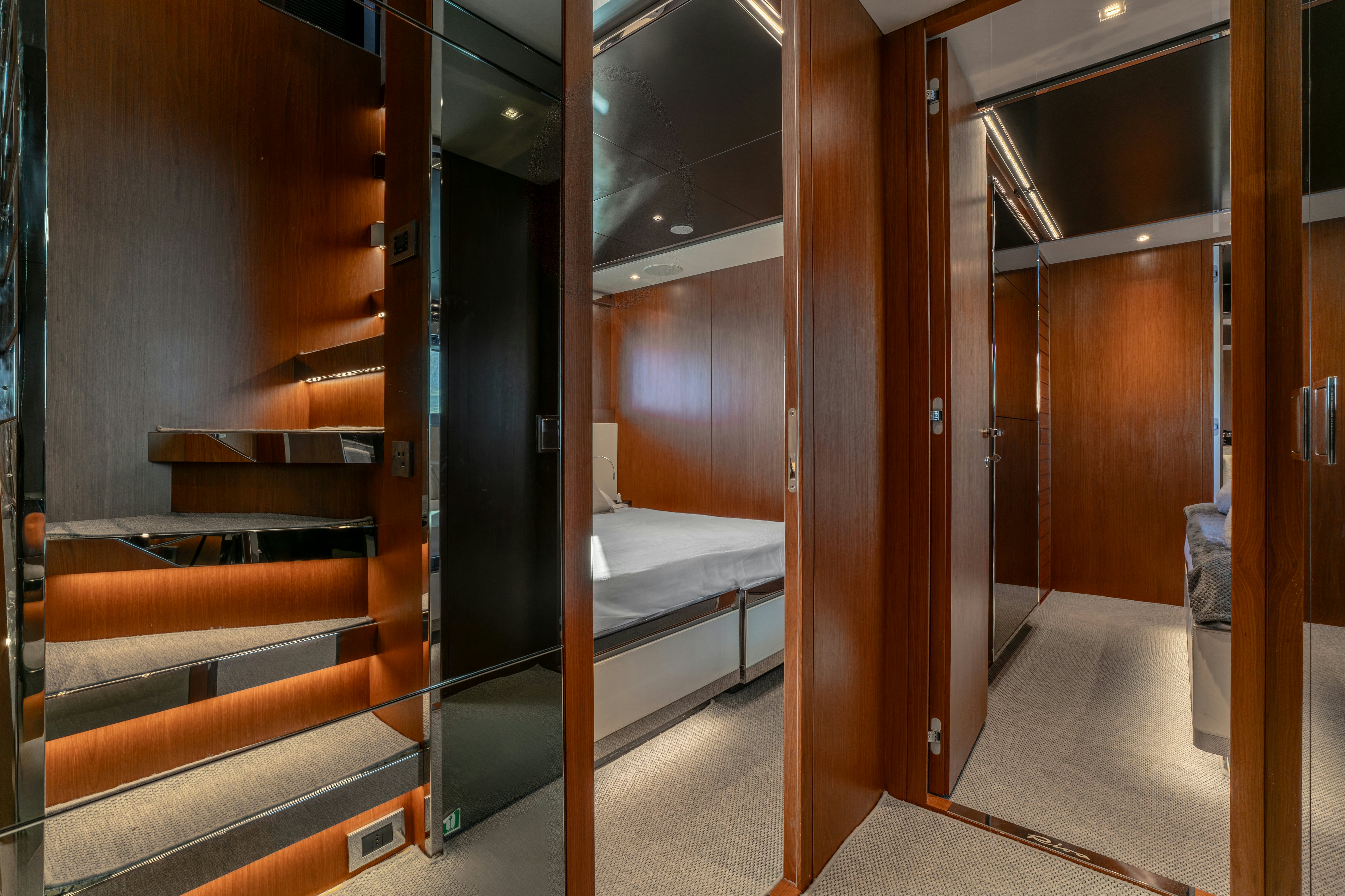 a room with wooden walls and a bed aboard NOI Yacht for Sale