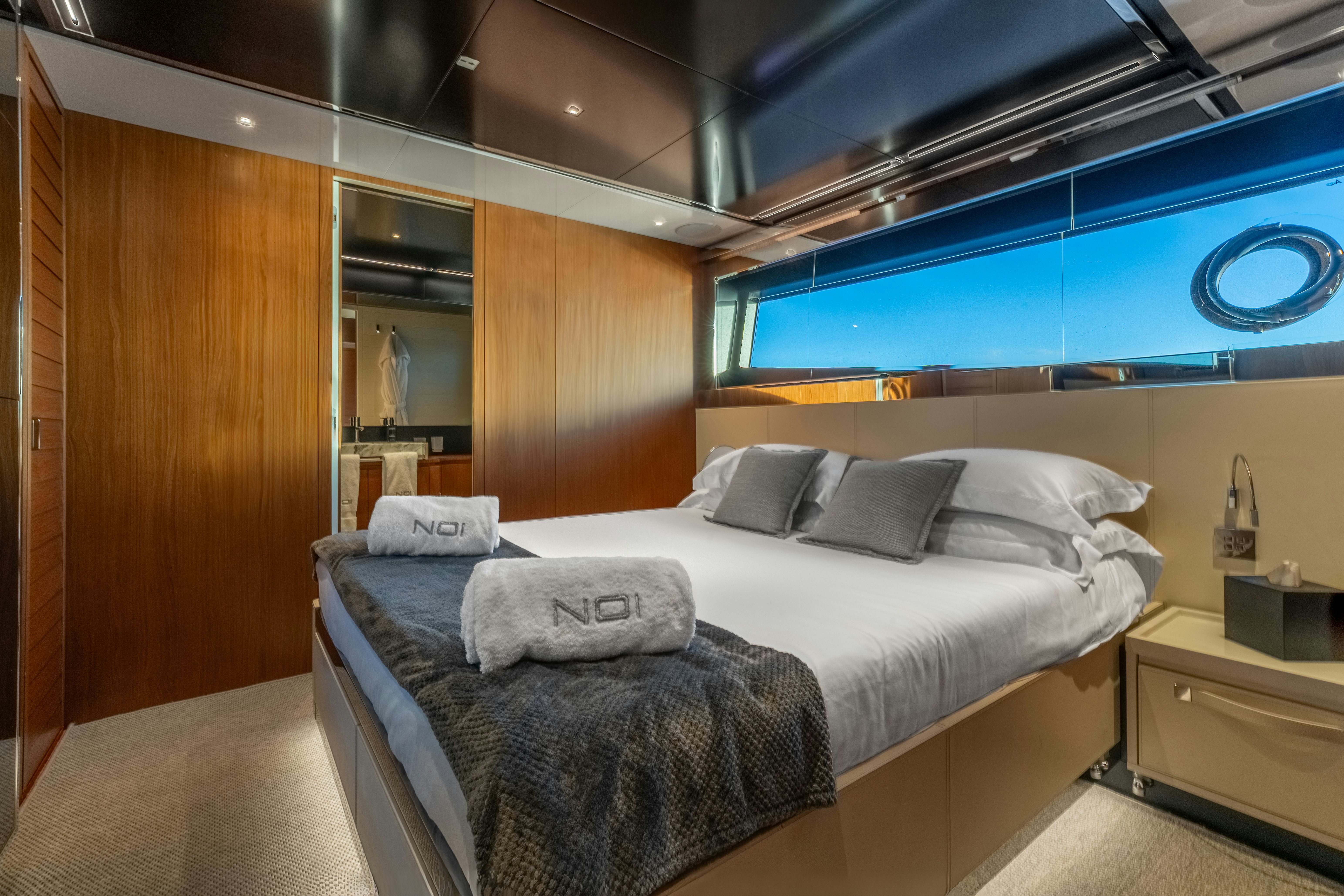 a bed in a room aboard NOI Yacht for Sale