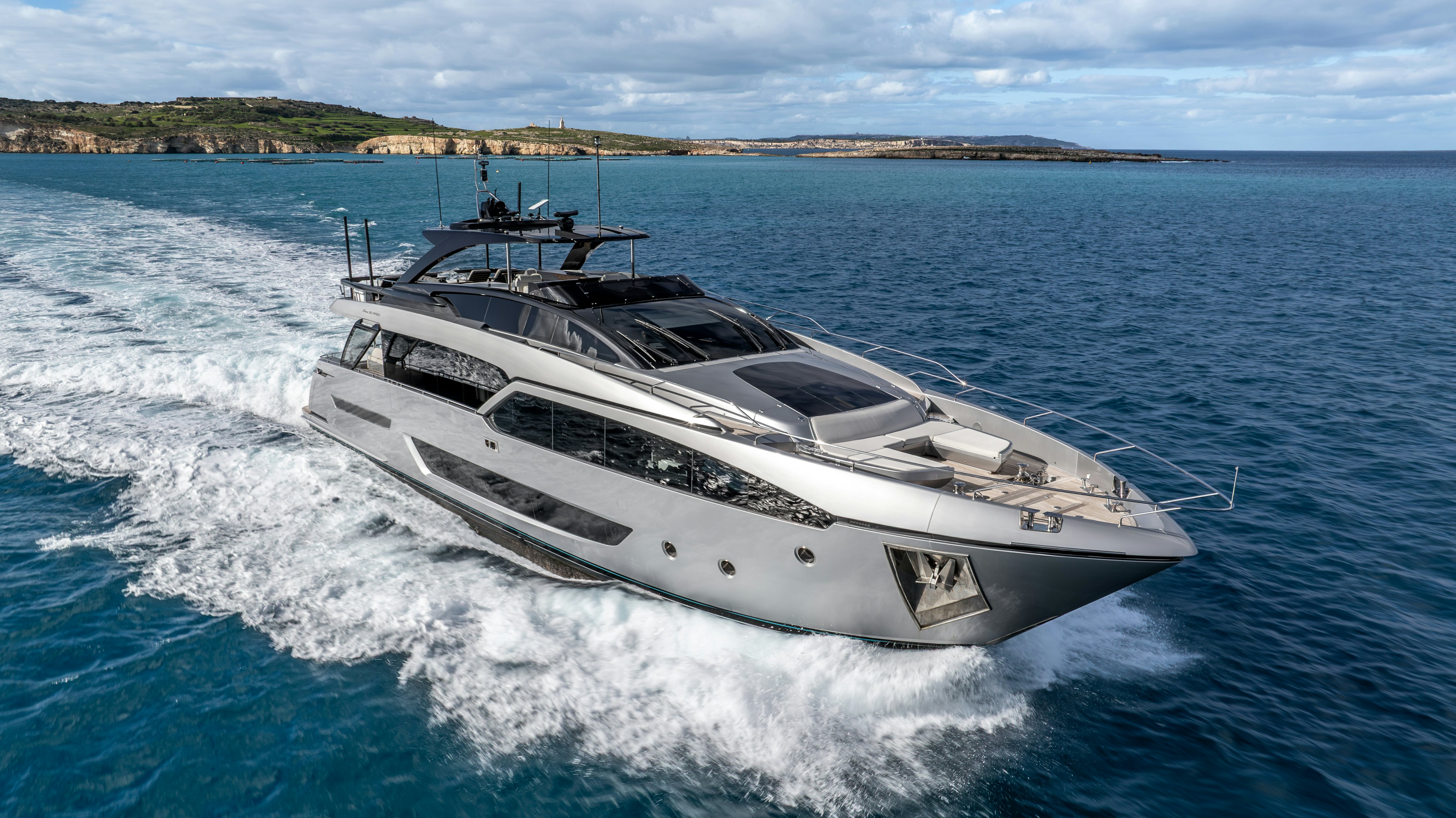 a white yacht on the water aboard NOI Yacht for Sale
