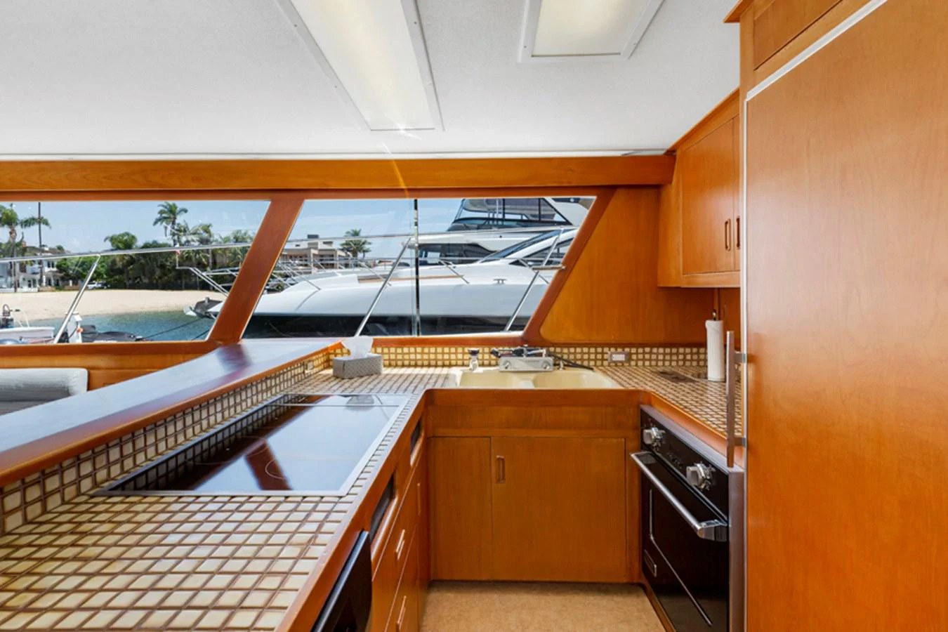 a kitchen with wooden cabinets aboard DON JUAN Yacht for Sale