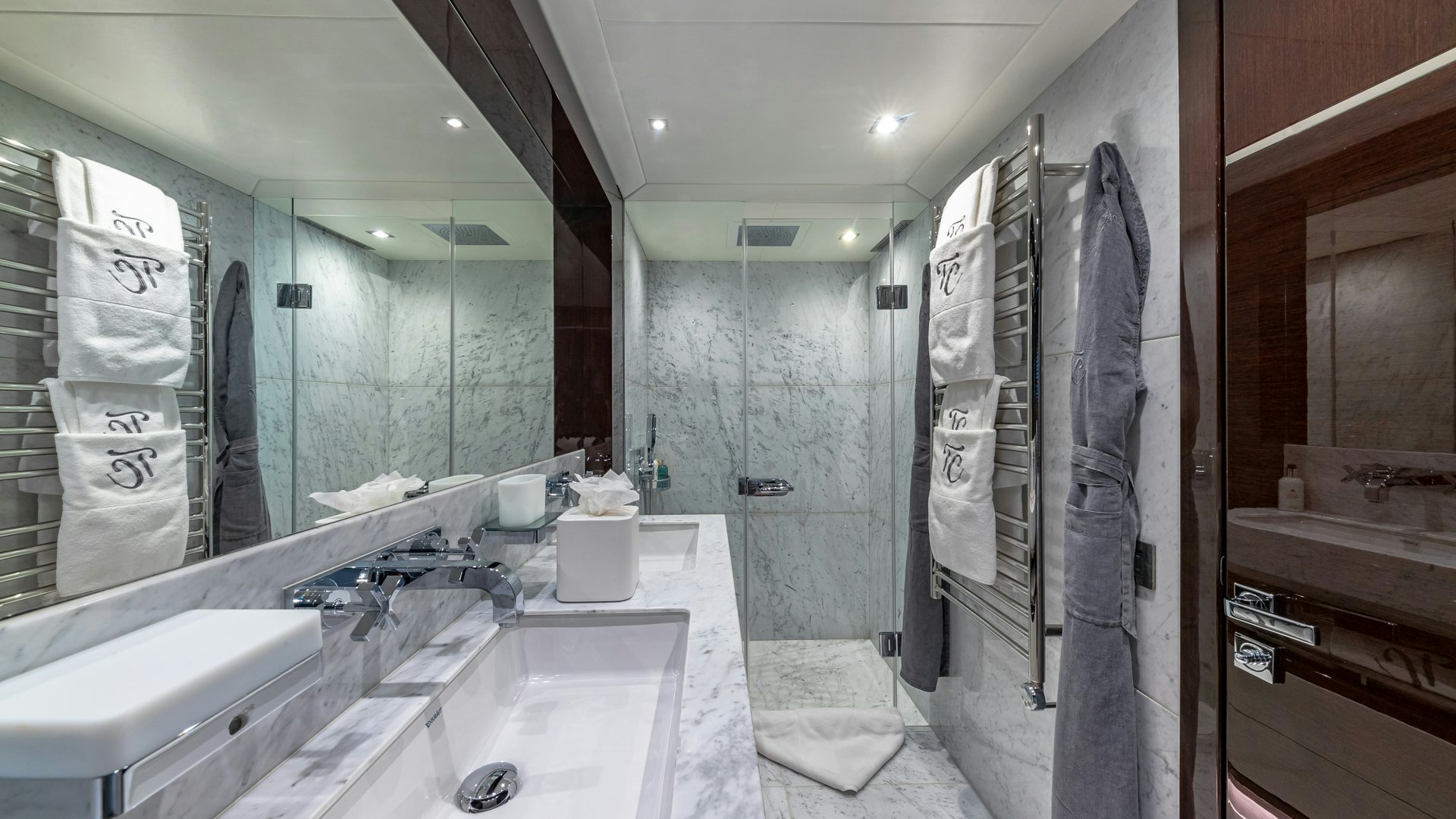 a bathroom with a large mirror aboard CAPTAIN MORGAN III Yacht for Charter