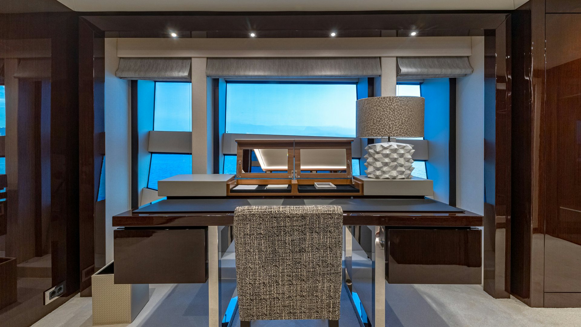 a room with a tv and a chair aboard CAPTAIN MORGAN III Yacht for Charter