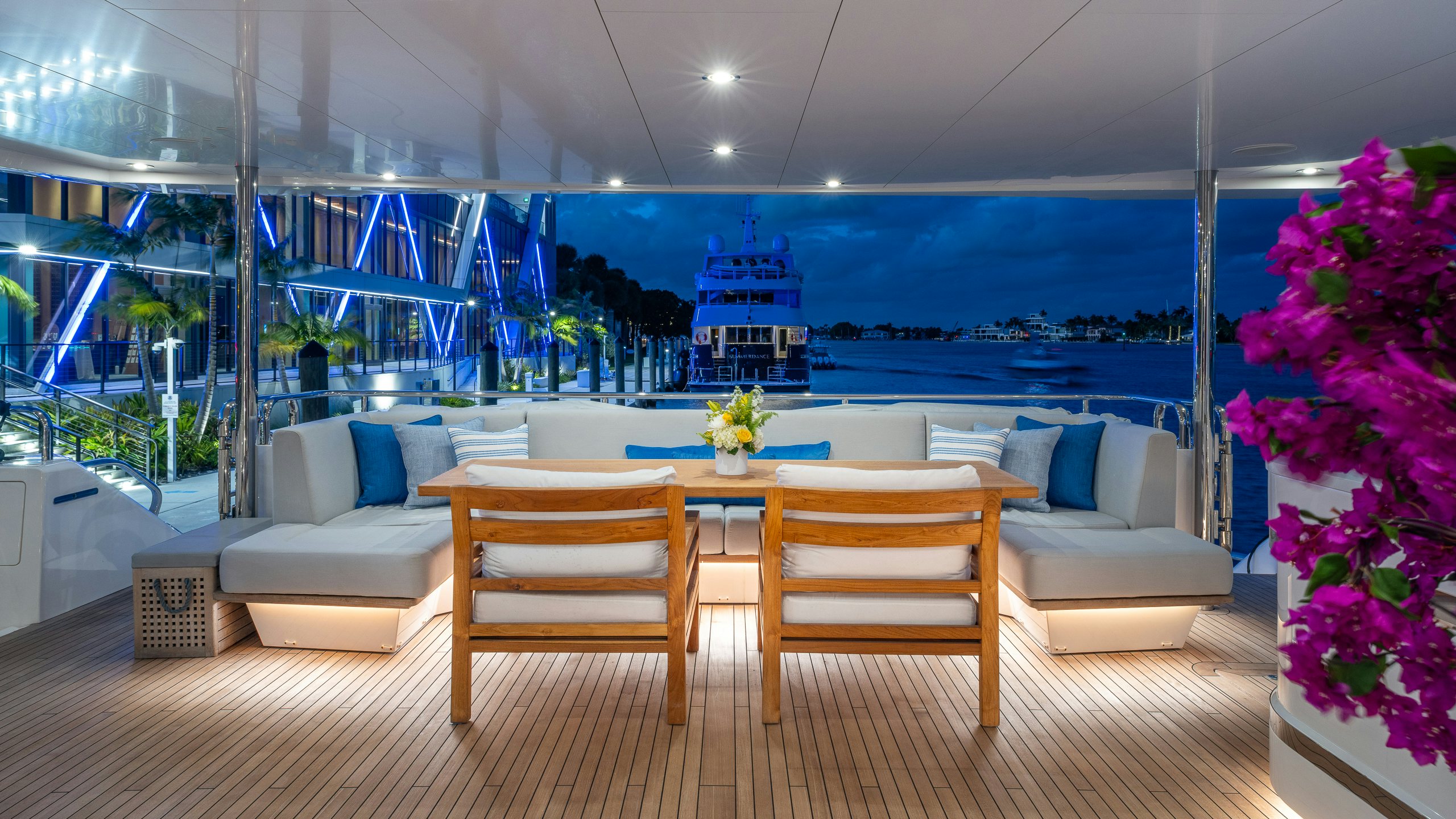 a room with a table and chairs aboard CAPTAIN MORGAN III Yacht for Charter