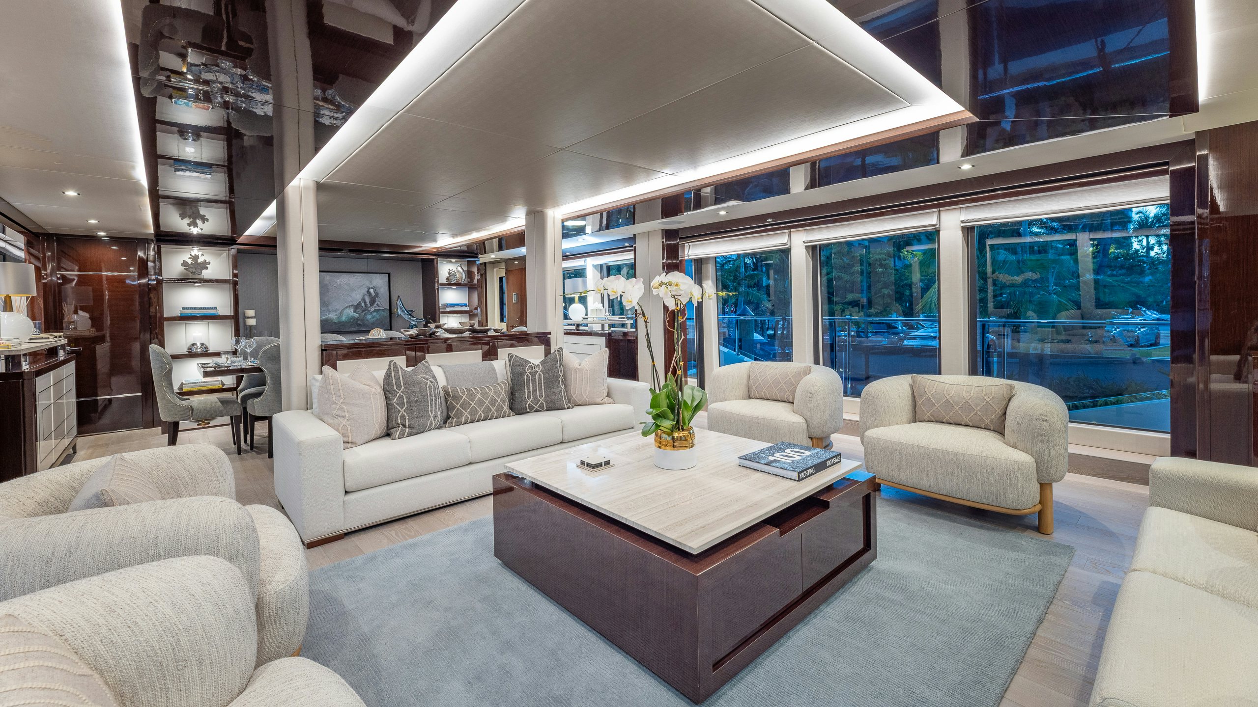 a living room with a large window aboard CAPTAIN MORGAN III Yacht for Charter