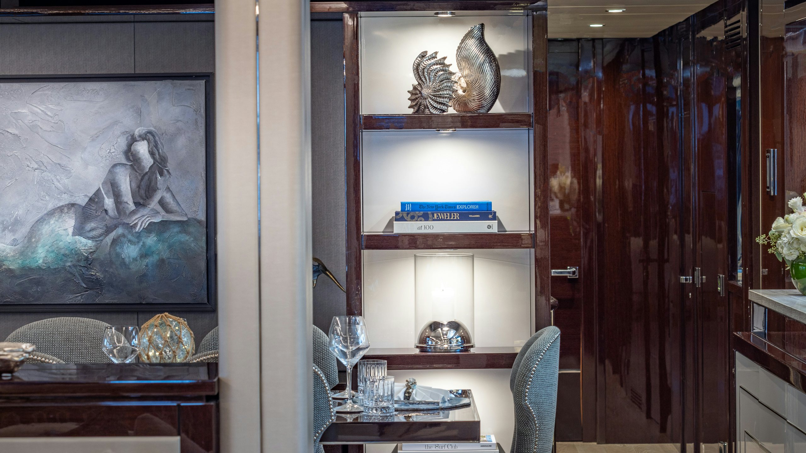 a room with a wood door and a painting on the wall aboard CAPTAIN MORGAN III Yacht for Charter