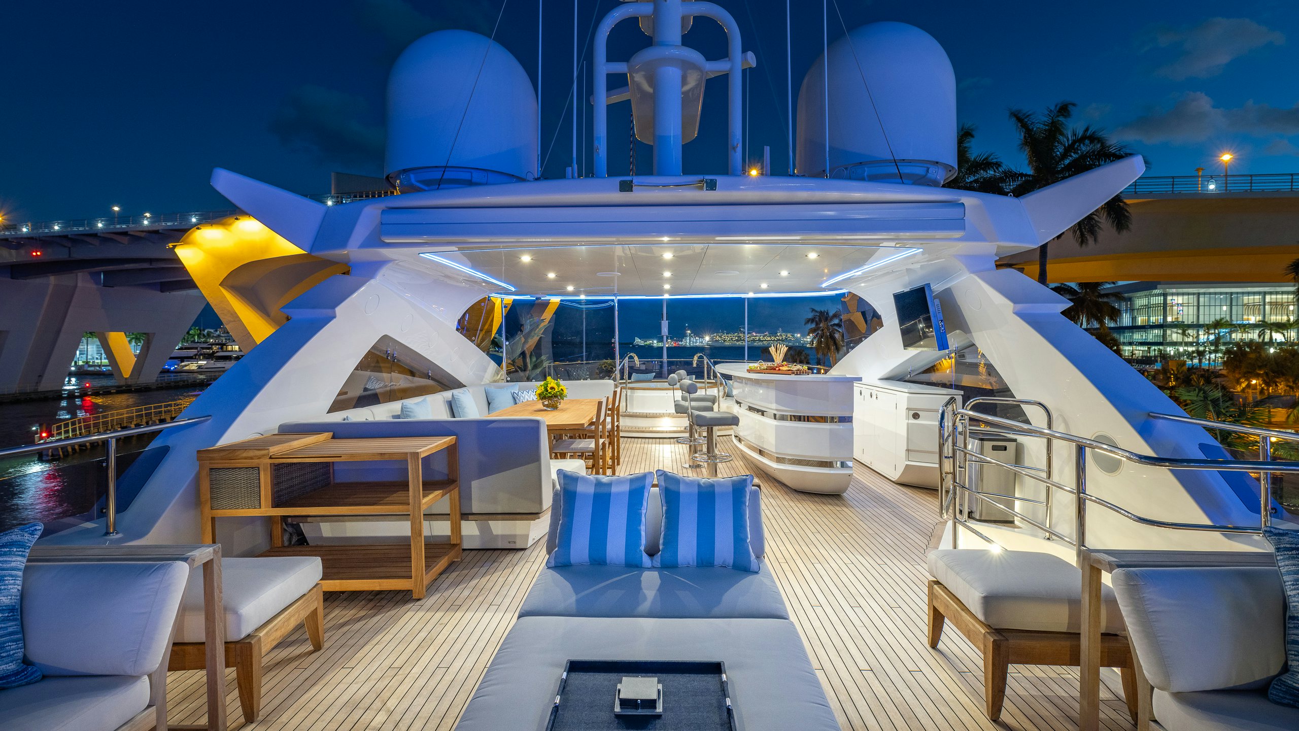 a large swimming pool with a deck and chairs aboard CAPTAIN MORGAN III Yacht for Charter
