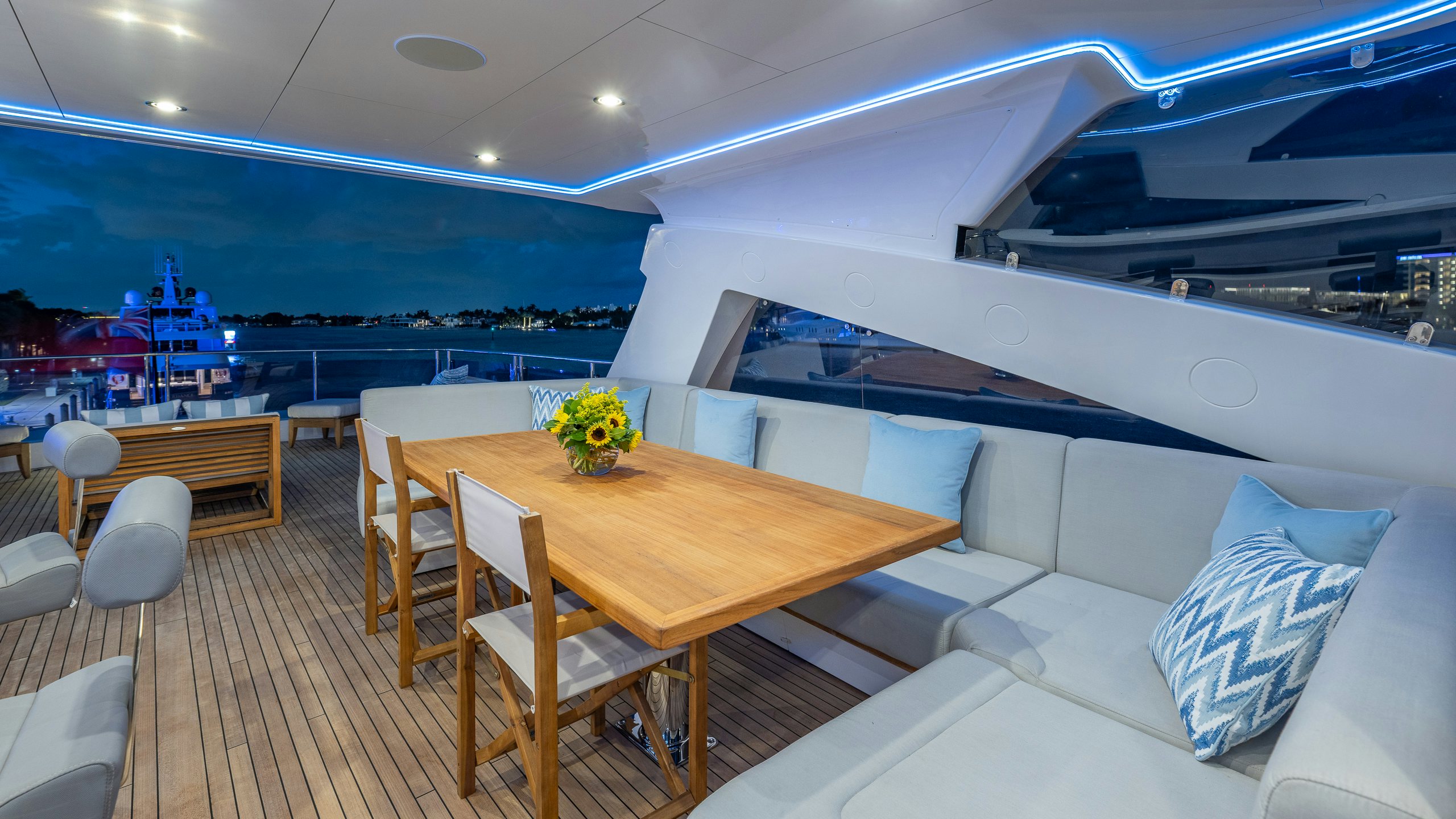 a room with a table and chairs aboard CAPTAIN MORGAN III Yacht for Charter