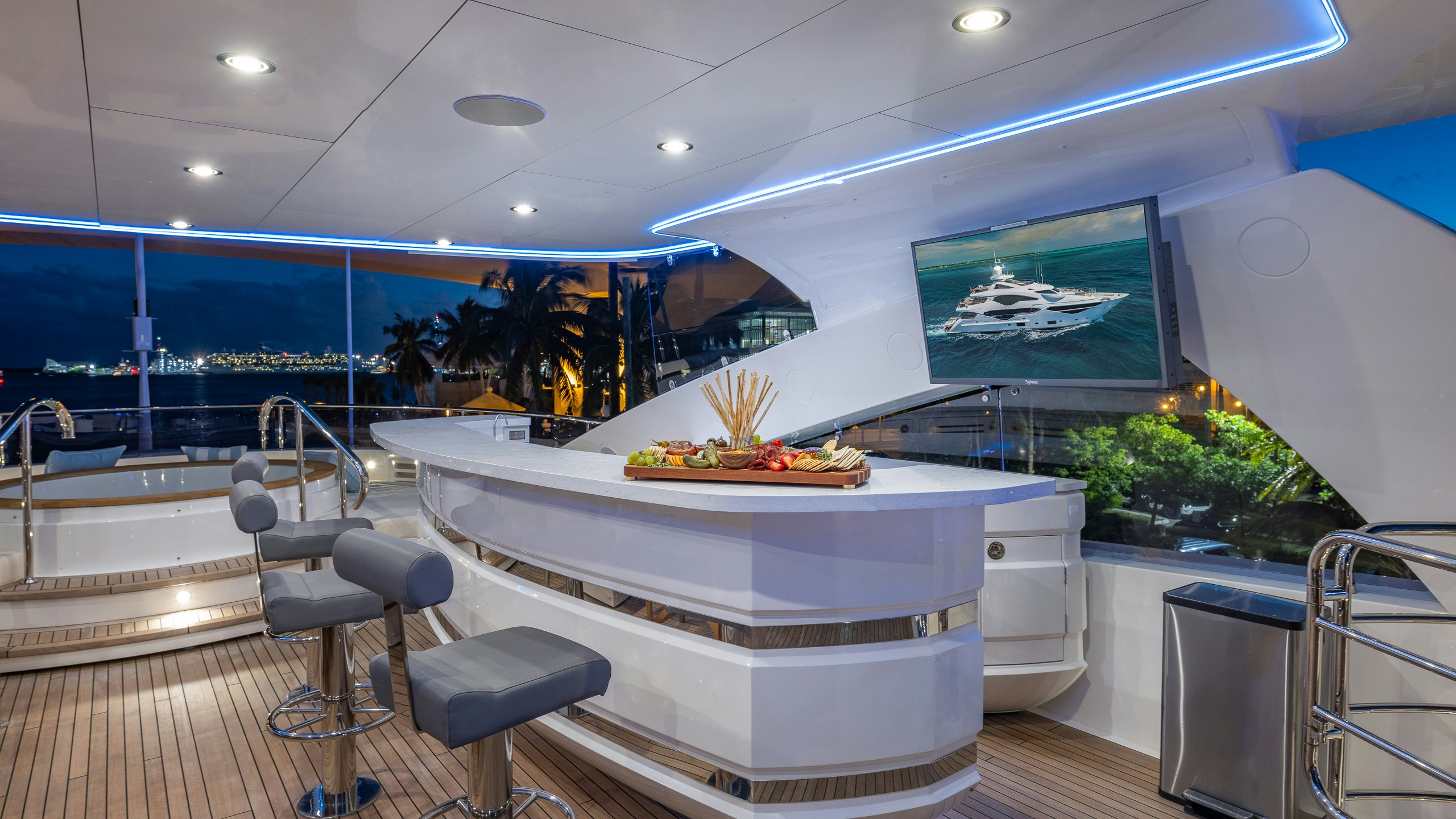 a modern kitchen with a large glass wall aboard CAPTAIN MORGAN III Yacht for Charter