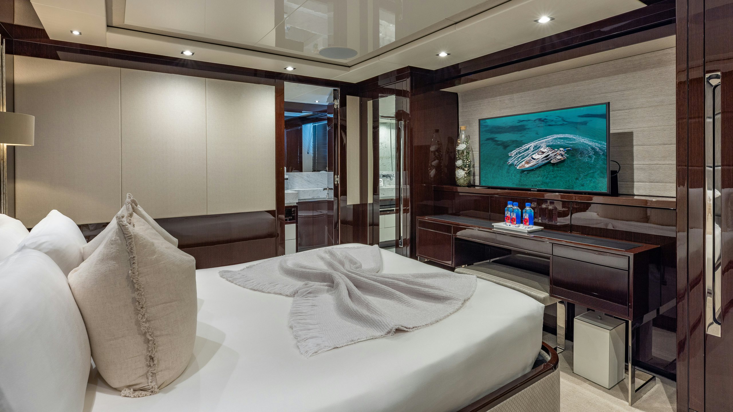 a hotel room with a large screen aboard CAPTAIN MORGAN III Yacht for Charter