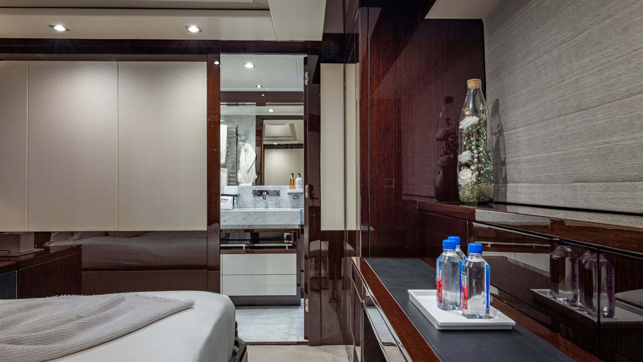 a room with a bed and a desk aboard CAPTAIN MORGAN III Yacht for Charter