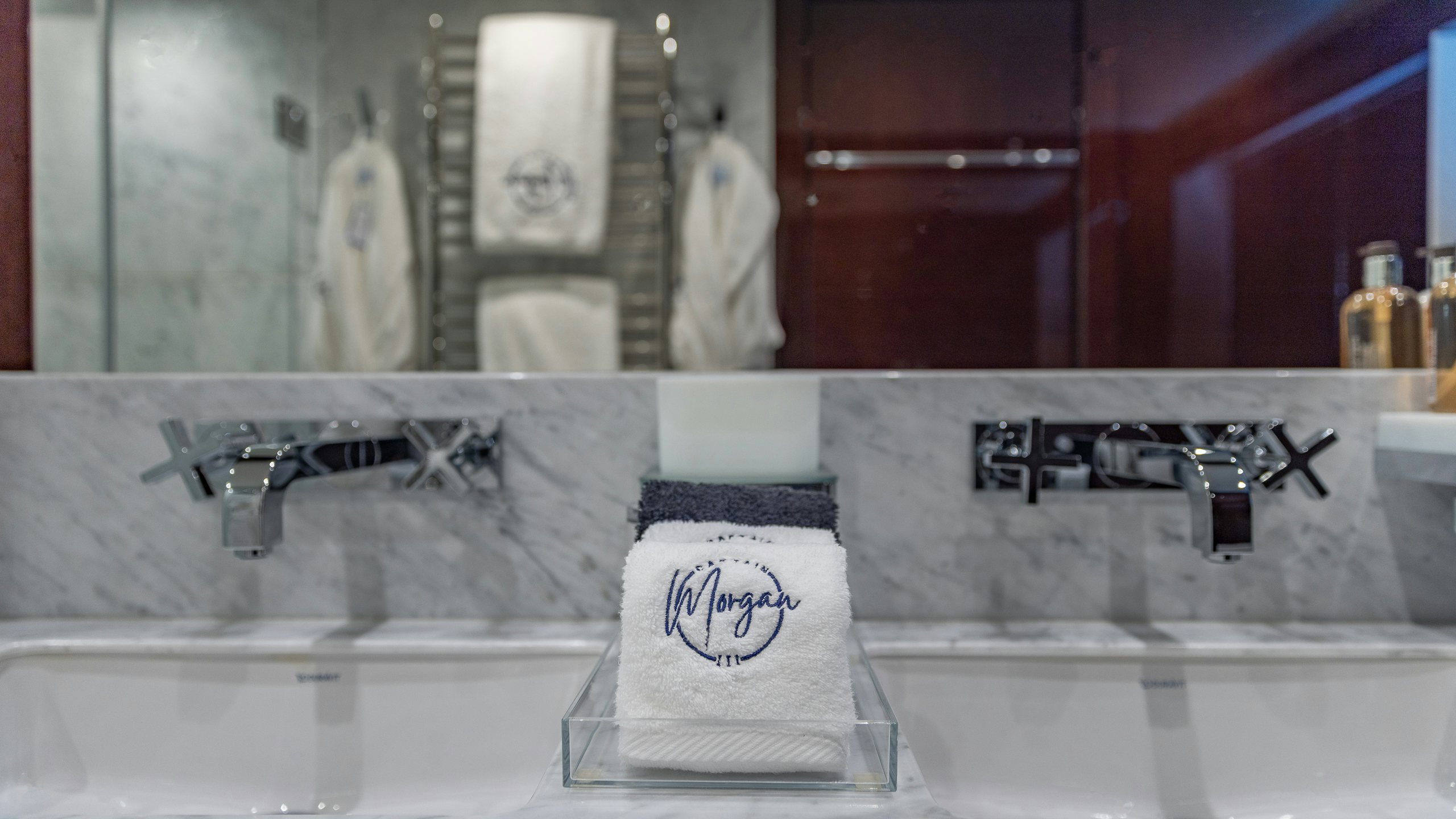 a bathroom with a sink and bathtub aboard CAPTAIN MORGAN III Yacht for Charter