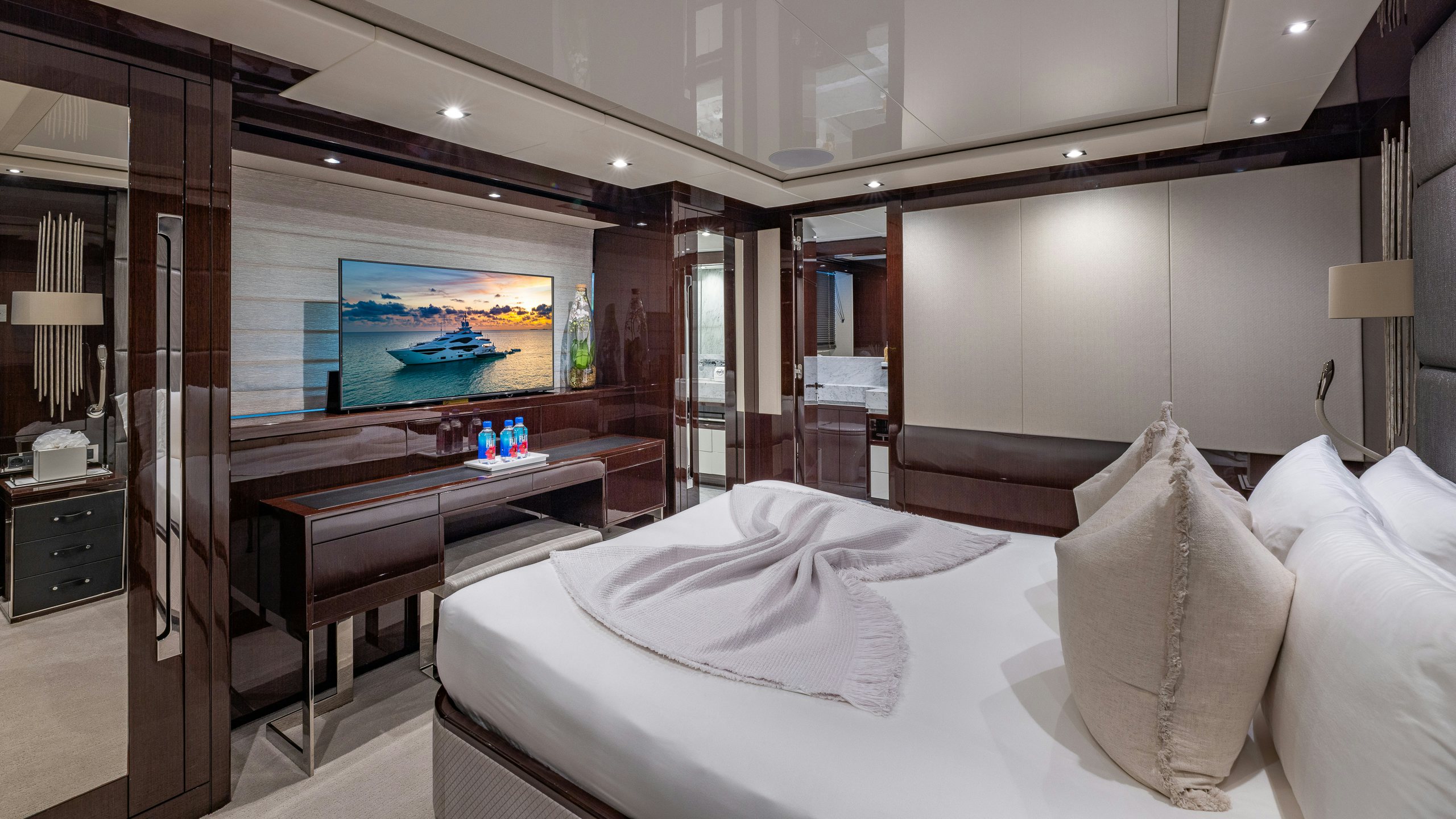 a hotel room with a large bed aboard CAPTAIN MORGAN III Yacht for Charter