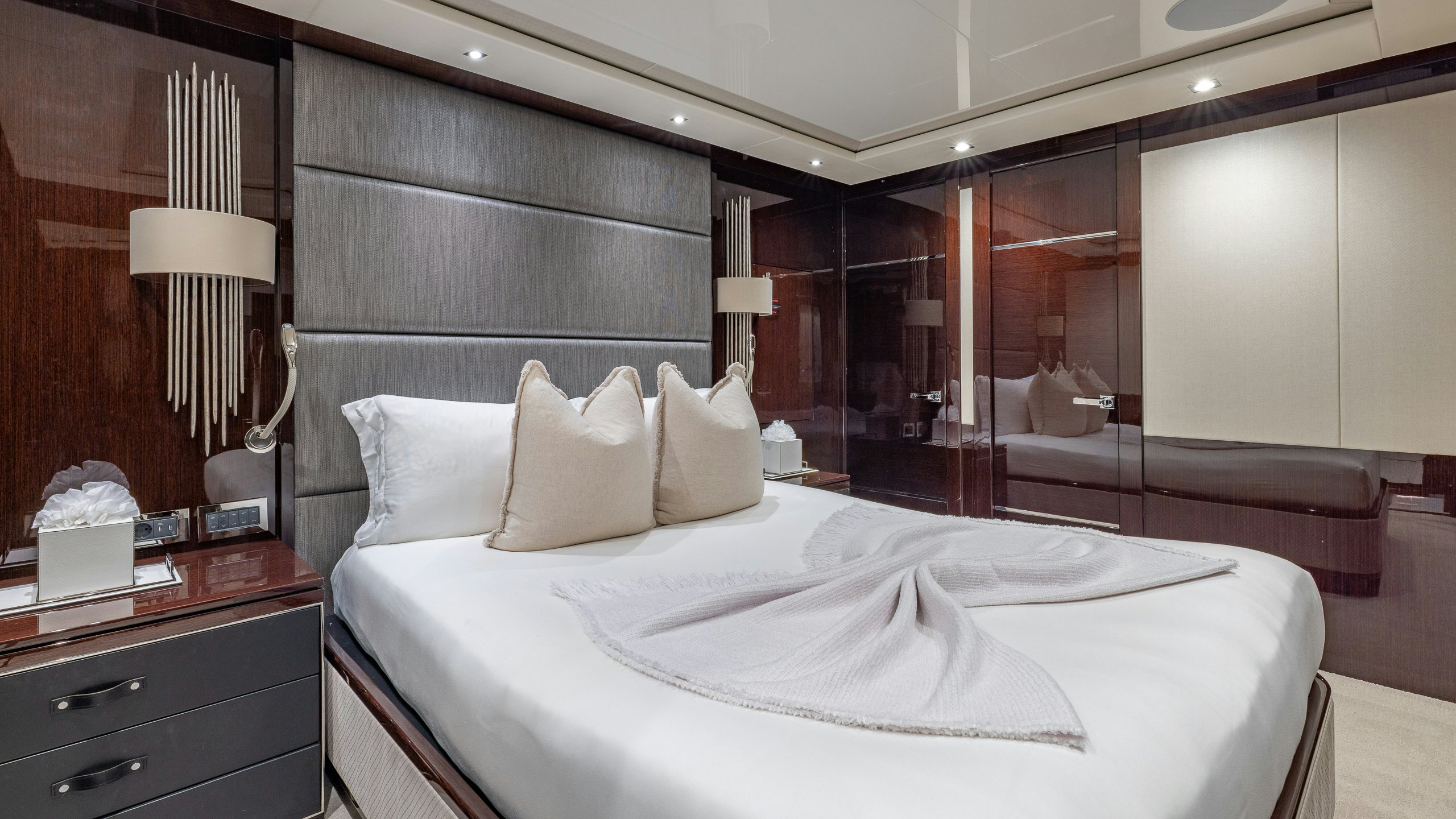 a hotel room with a bed aboard CAPTAIN MORGAN III Yacht for Charter