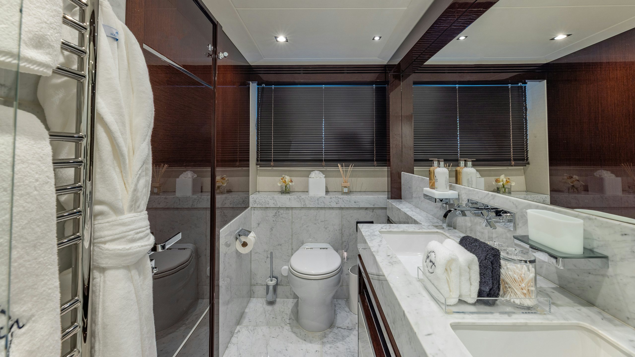 a bathroom with a bathtub toilet and sink aboard CAPTAIN MORGAN III Yacht for Charter