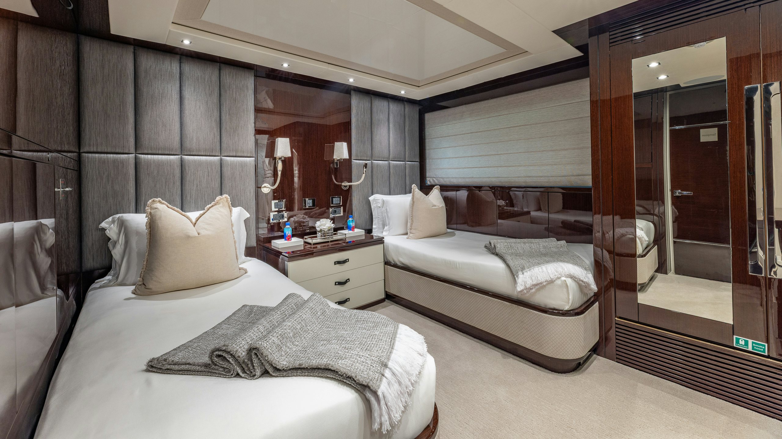 a hotel room with two beds aboard CAPTAIN MORGAN III Yacht for Charter