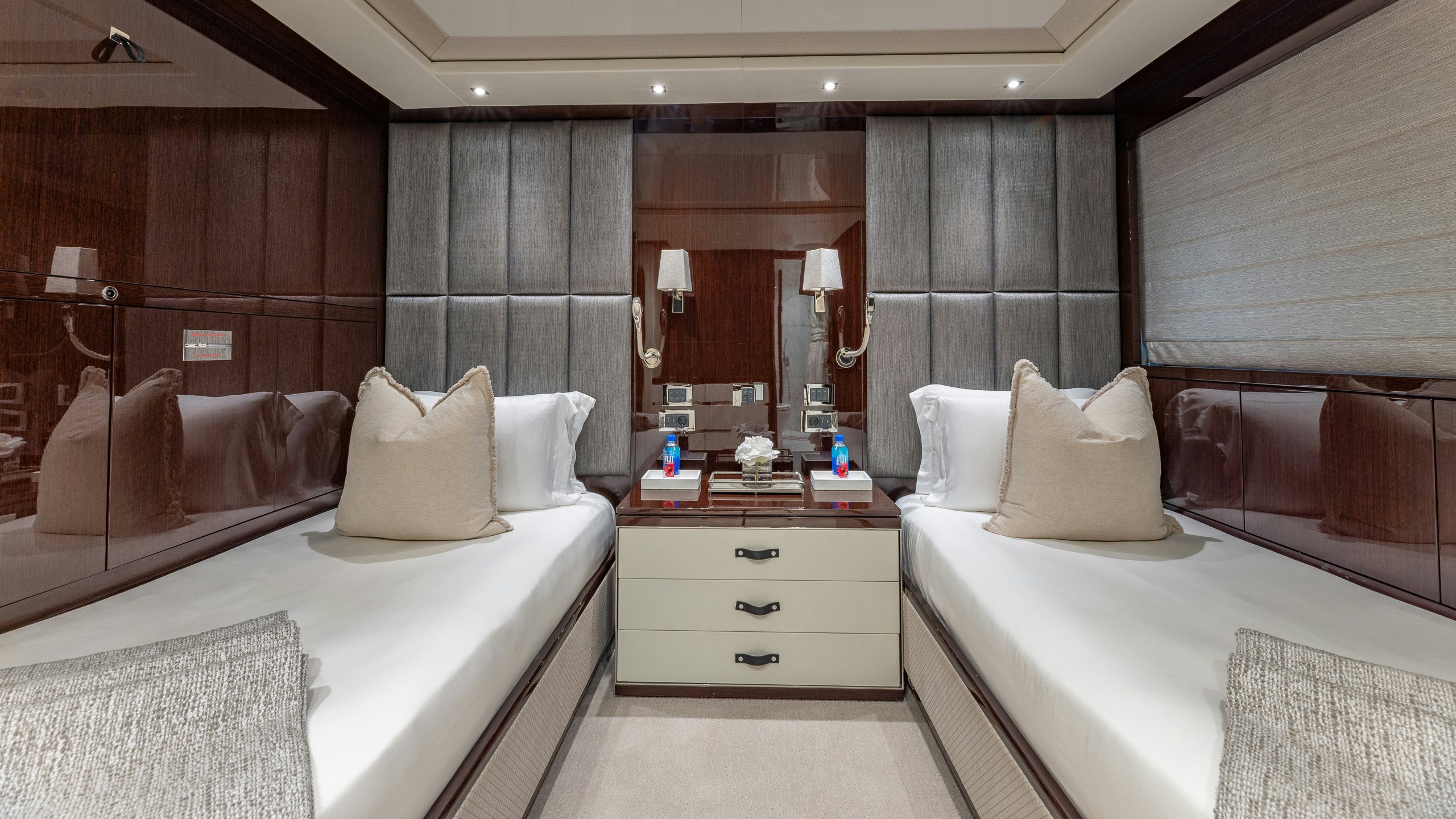 a room with a bed and a mirror aboard CAPTAIN MORGAN III Yacht for Charter
