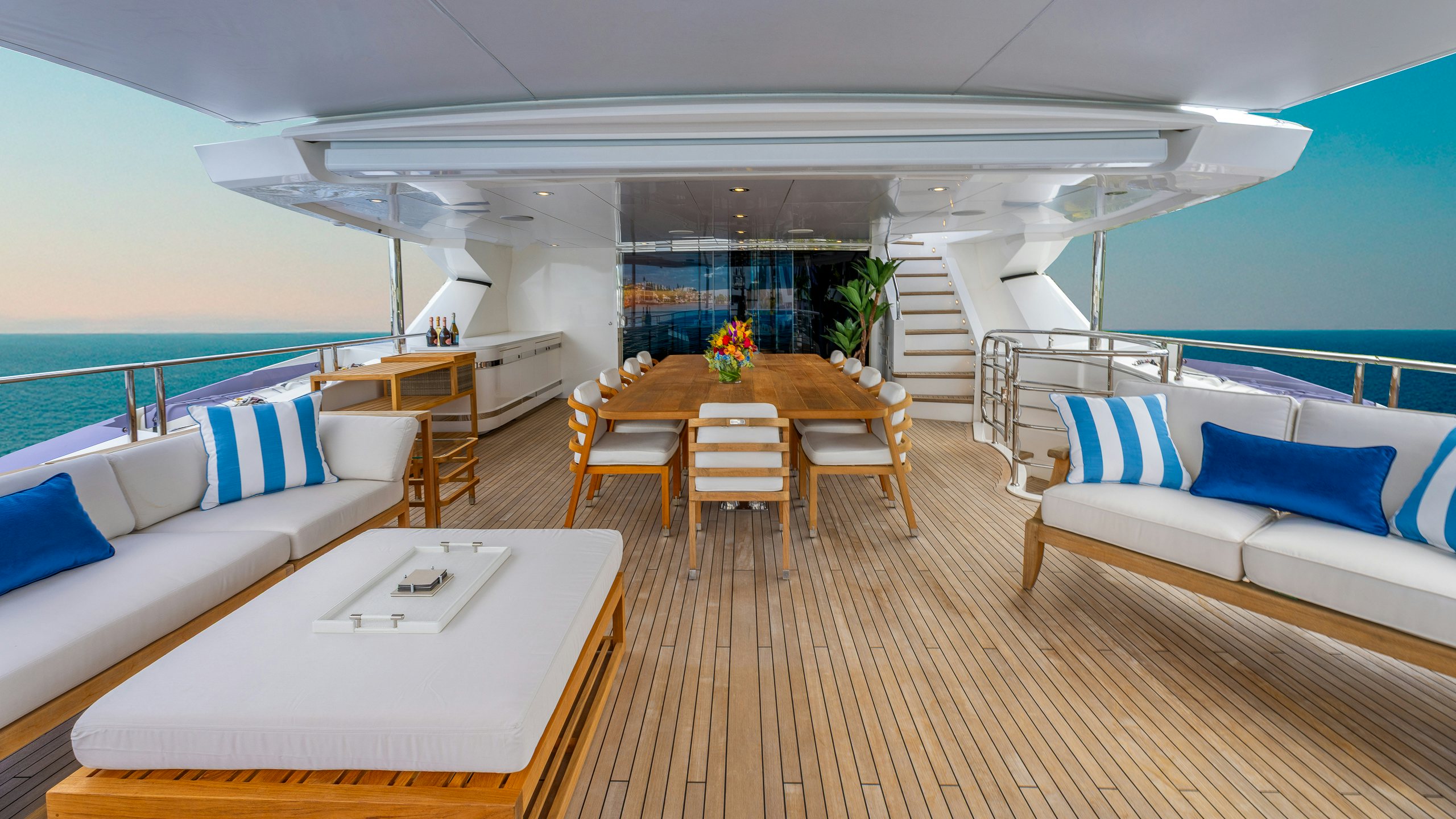 a room with a table and chairs aboard CAPTAIN MORGAN III Yacht for Charter